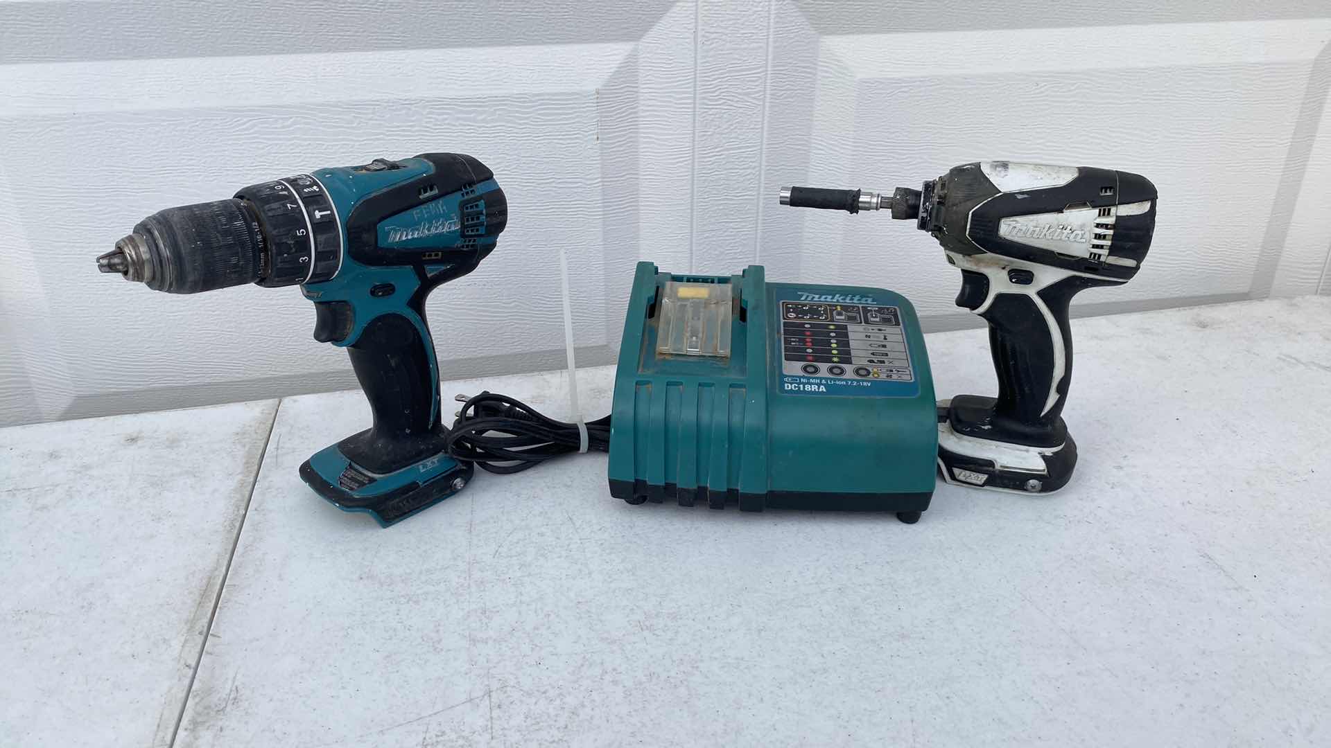 Photo 1 of MAKITA 18V IMPACT AND HAMMER DRILL AND BATTERY CHARGER NO BATTERY 
TESTED WORKING