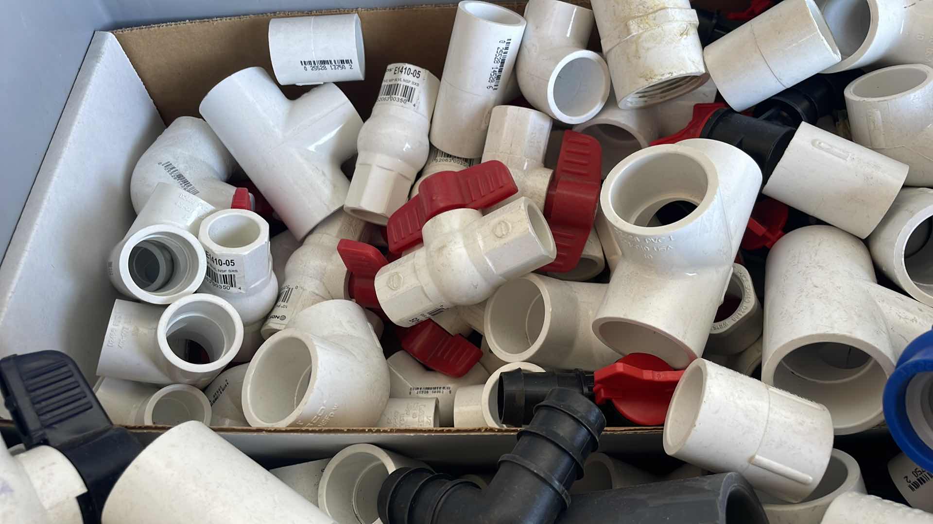 Photo 1 of BOXPLUS 24”x16”x17” FULL OF VARIOUS PVC TEES, ELBOWS, JUNCTIONS,  VALVES