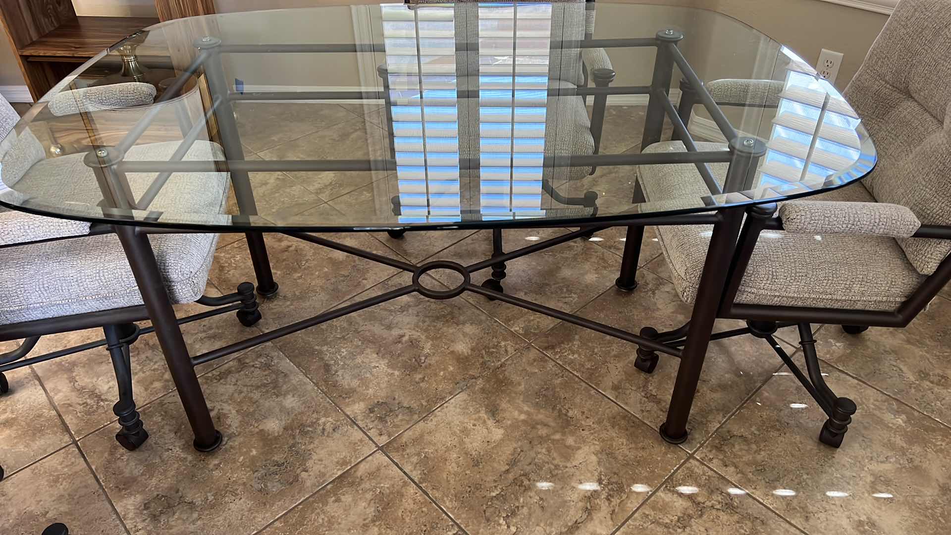 Photo 4 of WROUGHT IRON GLASSTOP TABLE W 4 WROUGHT IRON SWIVEL ROLLING CHAIRS (TABLE 50”x42” H30”)