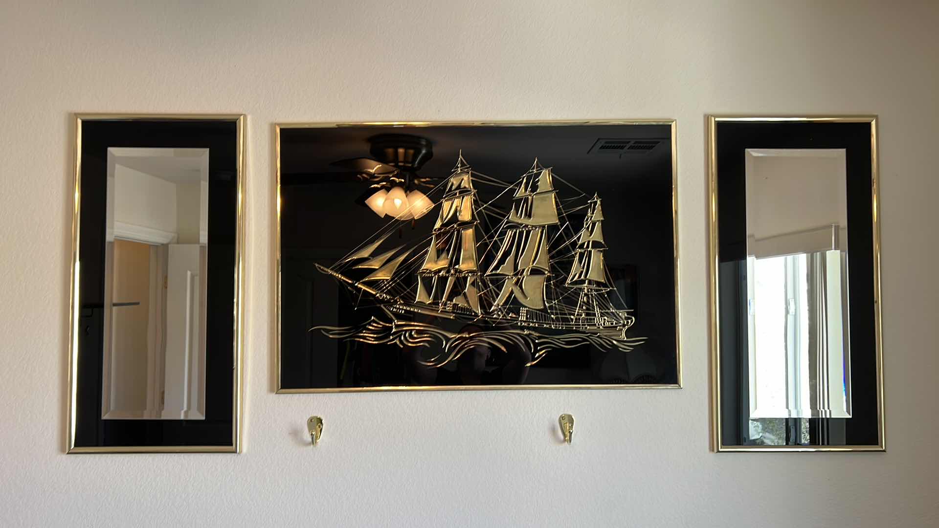 Photo 1 of GOLD TONED FRAMED MIRROR AND SHIP DESIGN WALL HANGINGS