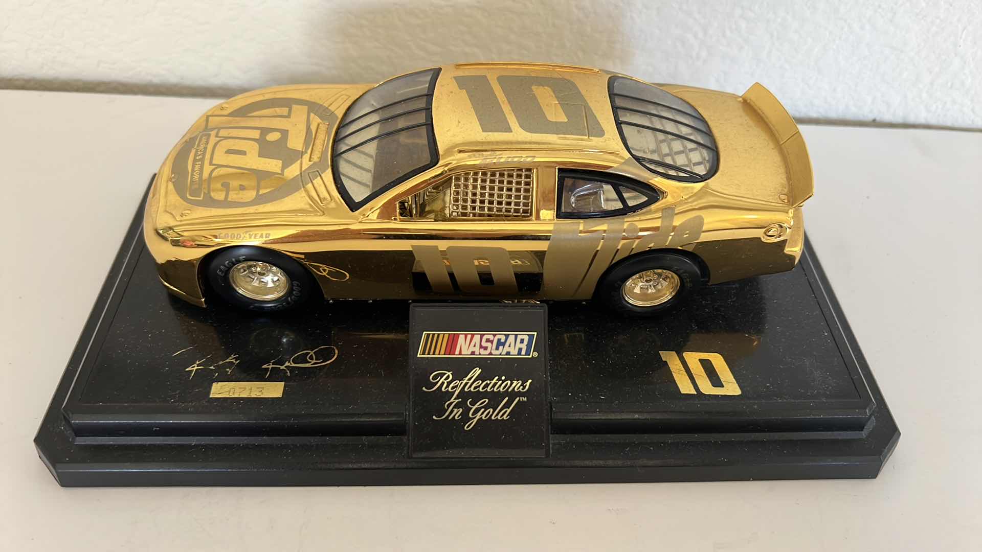 Photo 2 of FORD TAURUS NASCAR “REFLECTIONS IN GOLD” DIE CAST MODEL CAR