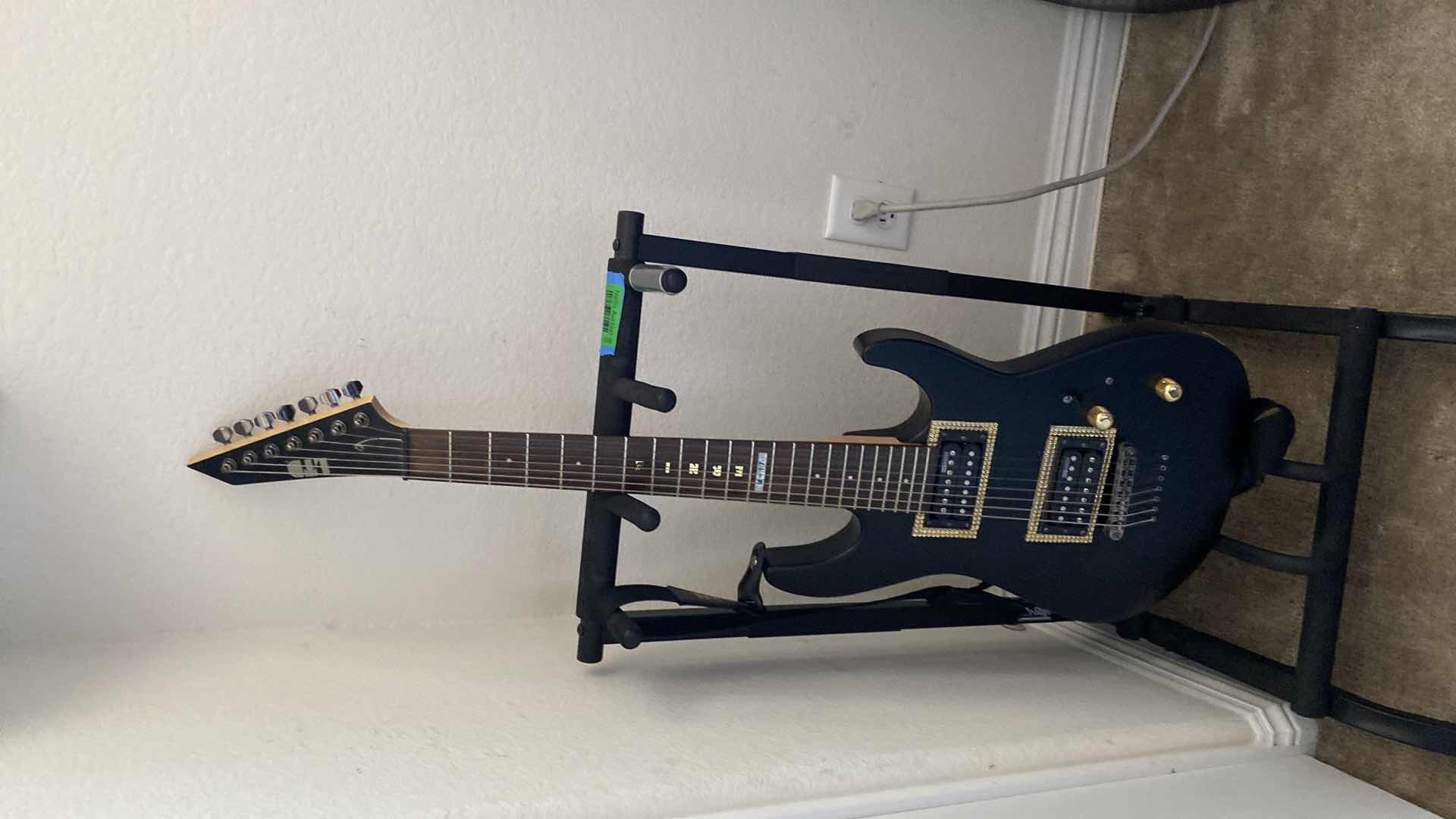 Photo 2 of LTD GUITAR WITH STRAP (STAND NOT INCLUDED)