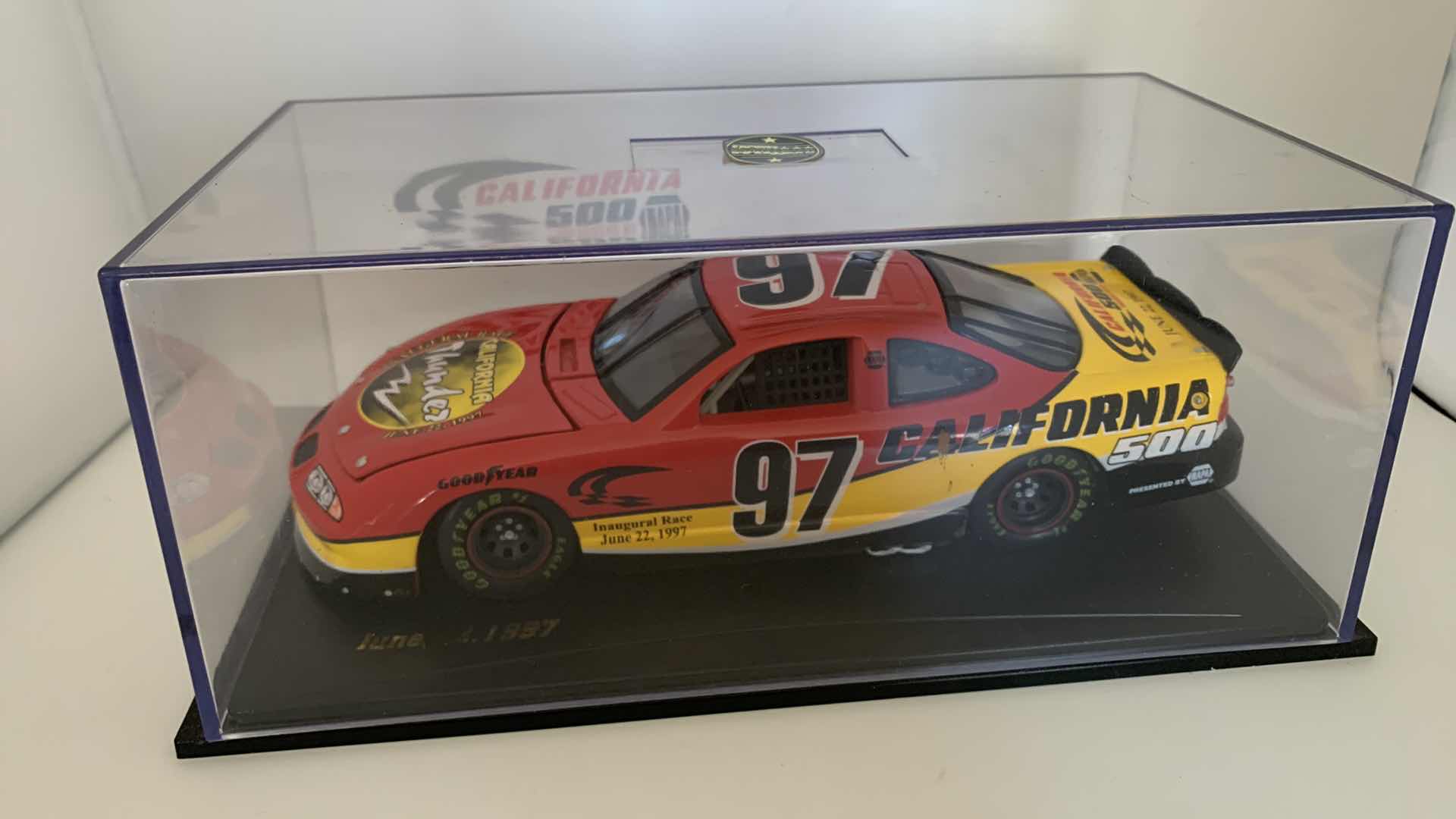 Photo 1 of SPORTS IMPRESSIONS JUNE 22, 1997 CALIFORNIA THUNDER DIE CAST RACE CAR IN SHOW CASE.