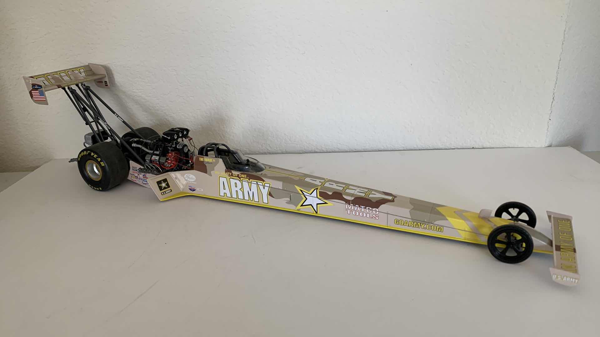 Photo 1 of ARMY TOP FUEL DIE CAST RACE CAR.