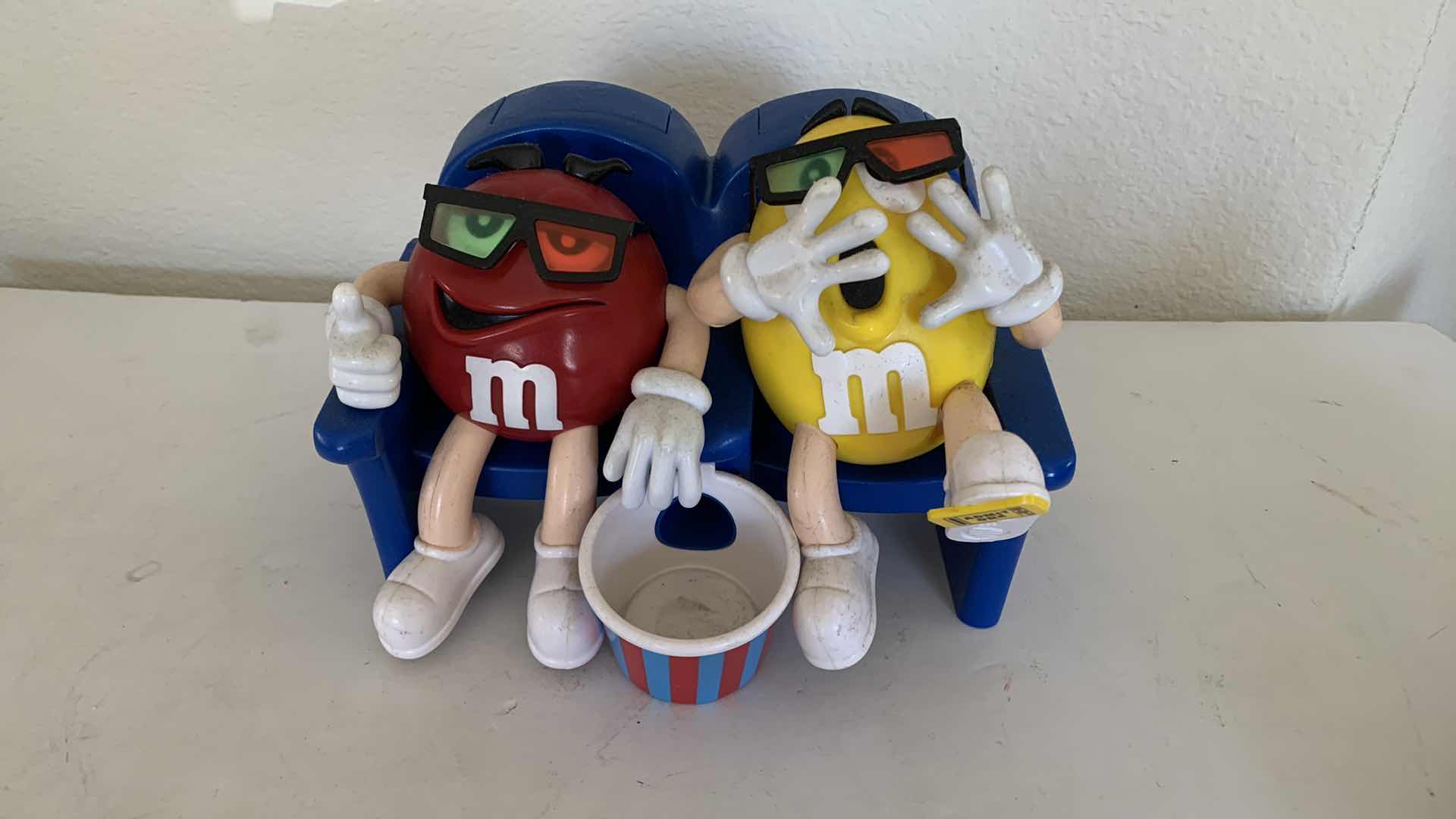 Photo 2 of M & Ms RED AND YELLOW 3D MOVIE CANDY DISPENSER COLLECTIBLE.