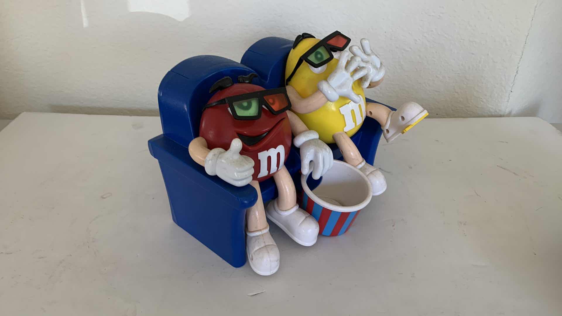 Photo 3 of M & Ms RED AND YELLOW 3D MOVIE CANDY DISPENSER COLLECTIBLE.
