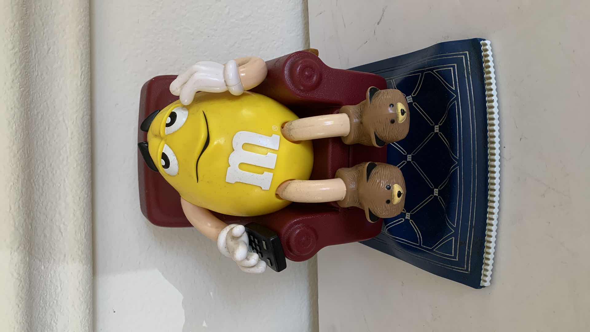 Photo 1 of M & Ms YELLOW IN RECLINER, COLLECTIBLE CANDY DISPENSER.