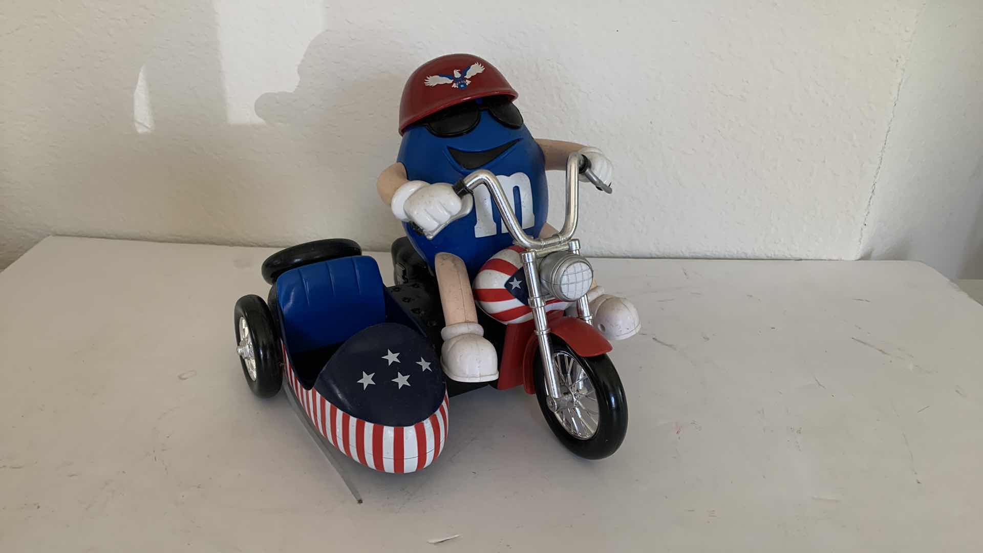 Photo 1 of M & Ms BLUE IN RED WHITE AND BLUE CHOPPER W. SIDE CAR COLLECTIBLE CANDY DISPENSER.