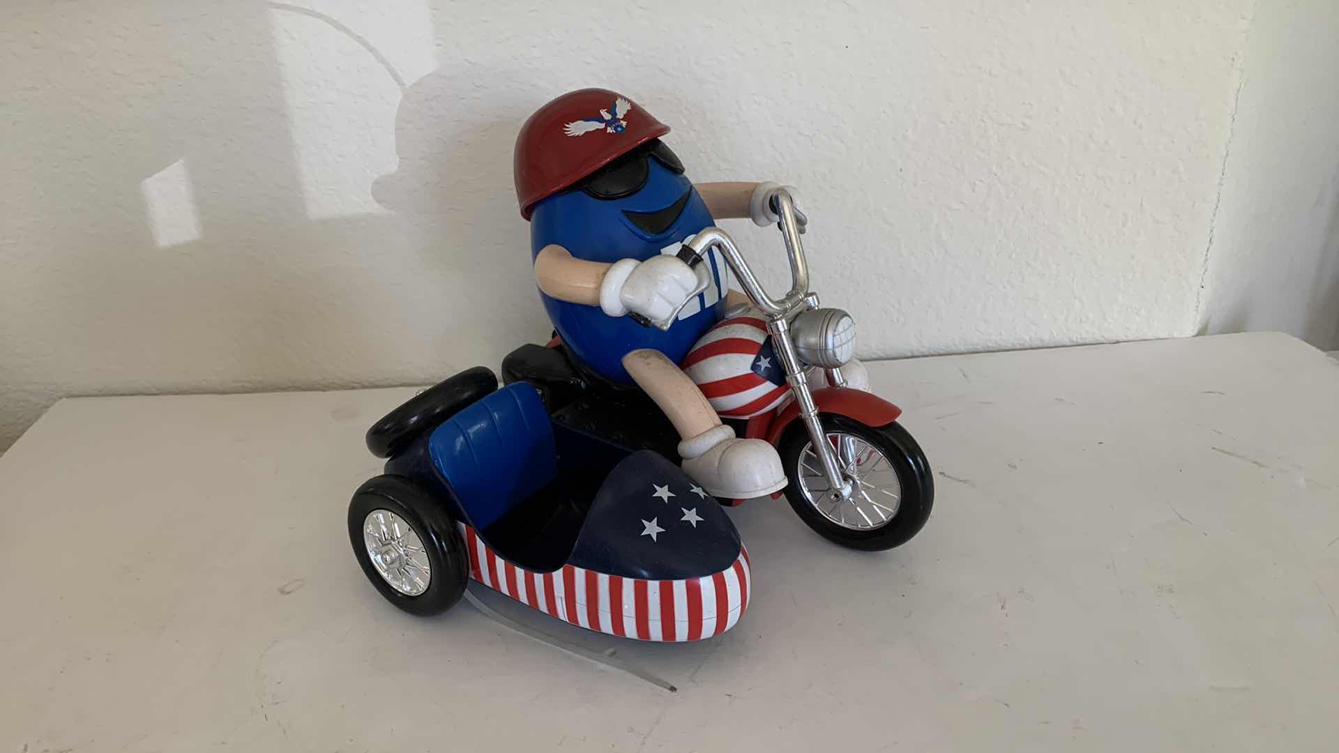 Photo 2 of M & Ms BLUE IN RED WHITE AND BLUE CHOPPER W. SIDE CAR COLLECTIBLE CANDY DISPENSER.
