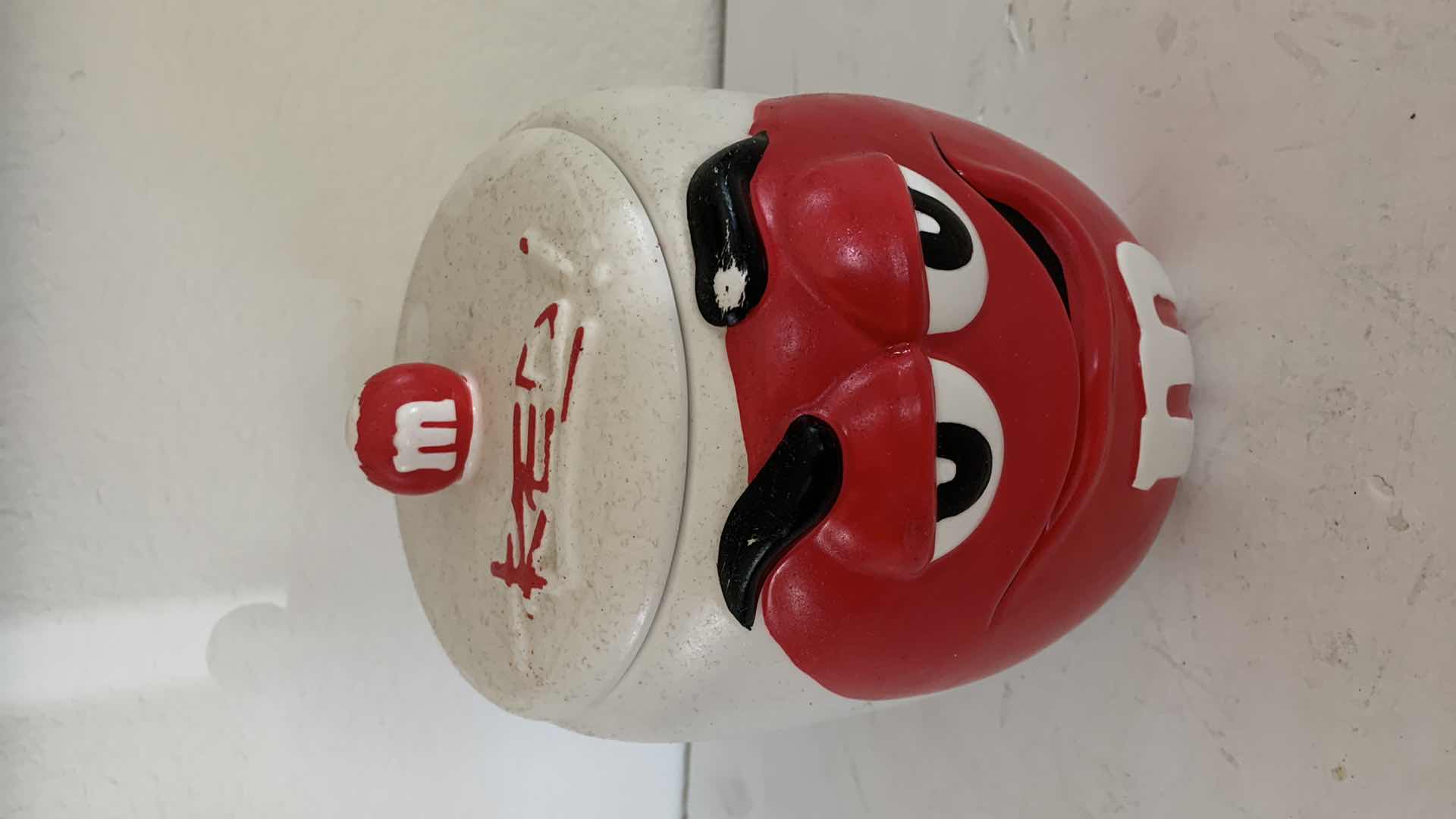 Photo 2 of M & Ms RED CERAMIC CANISTER.