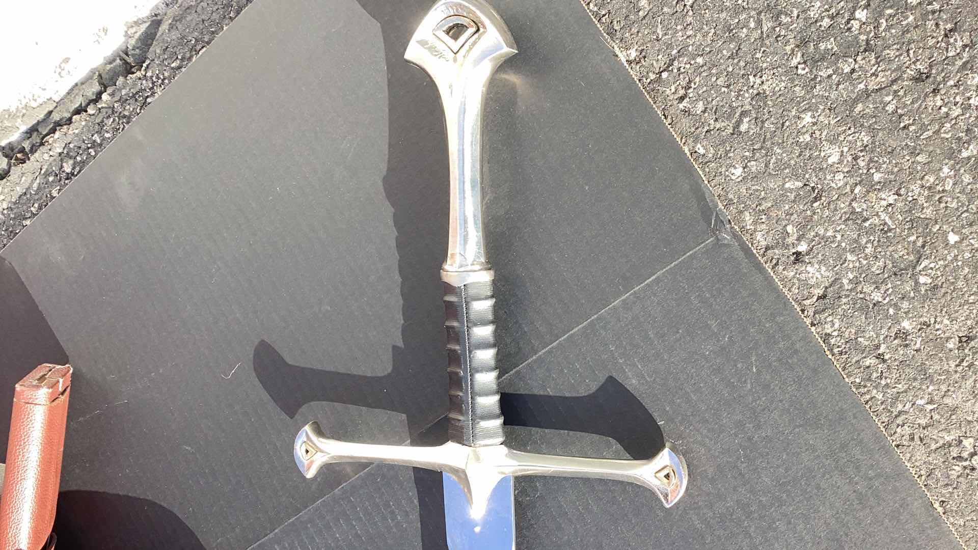 Photo 3 of METAL SWORD 47” LONG WITH LEATHER ACCESSORIES