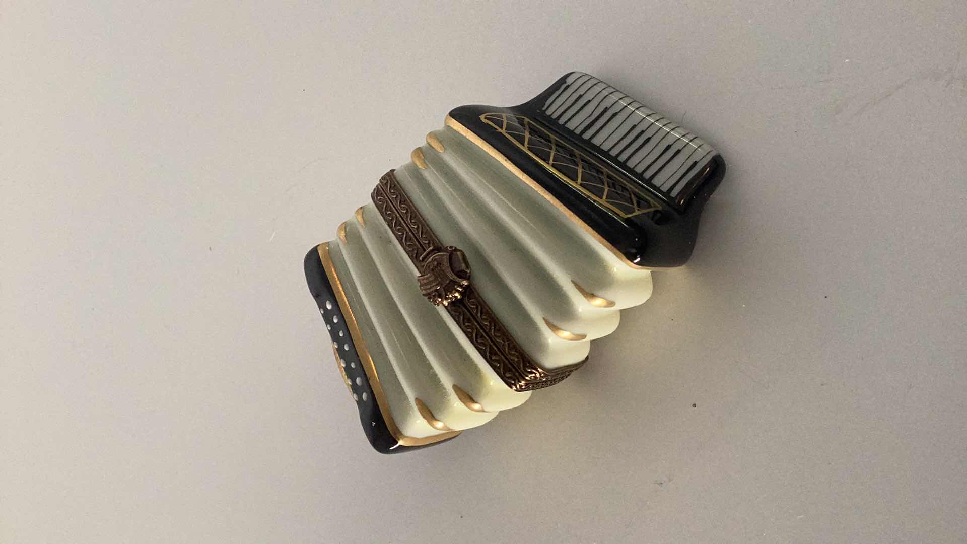 Photo 1 of LIMOGES FRANCE ACCORDIAN PILL BOX 3” WIDE 