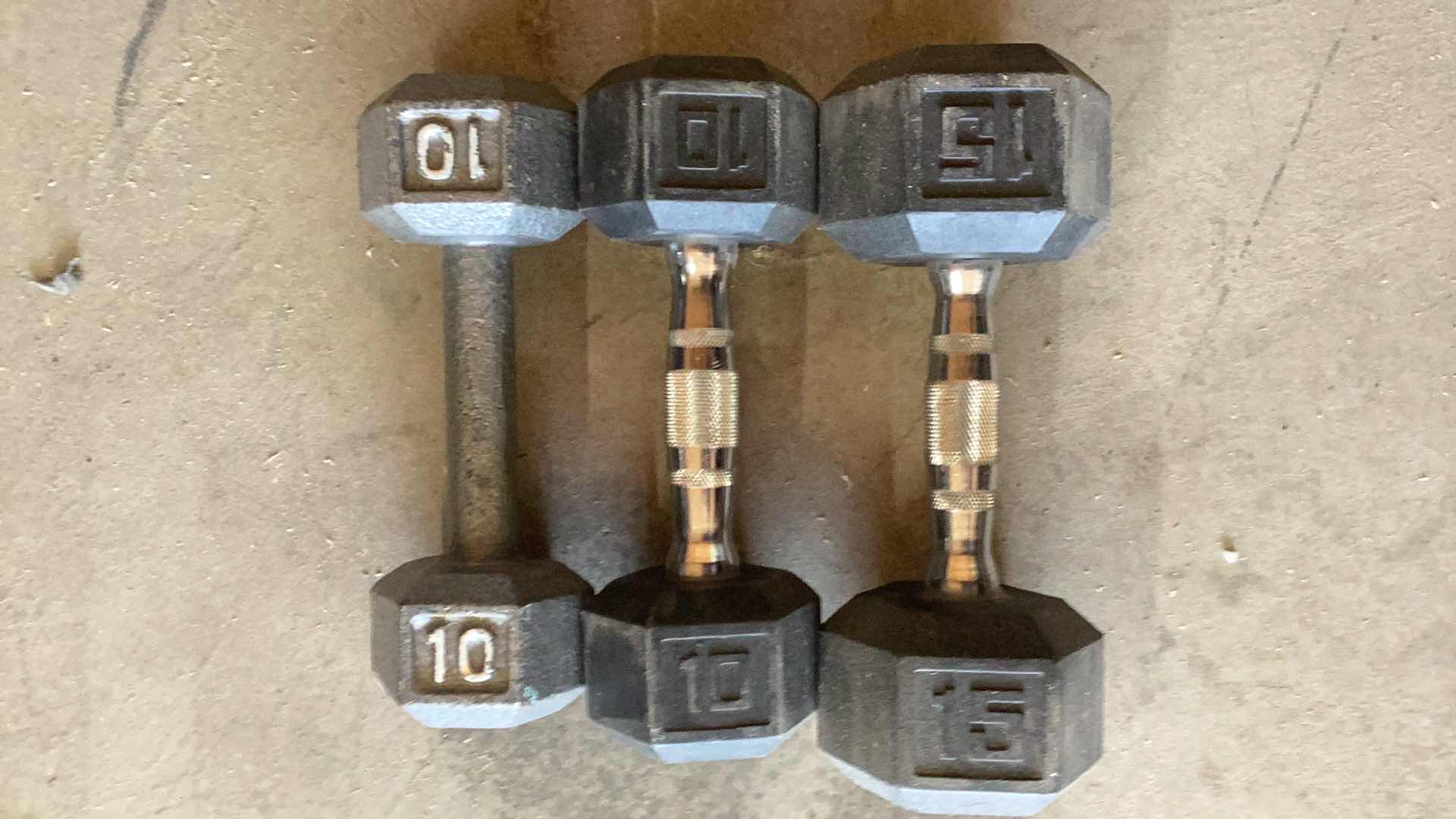 Photo 3 of 3 DUMB BELLS 10, 10, AND A 15 POUND