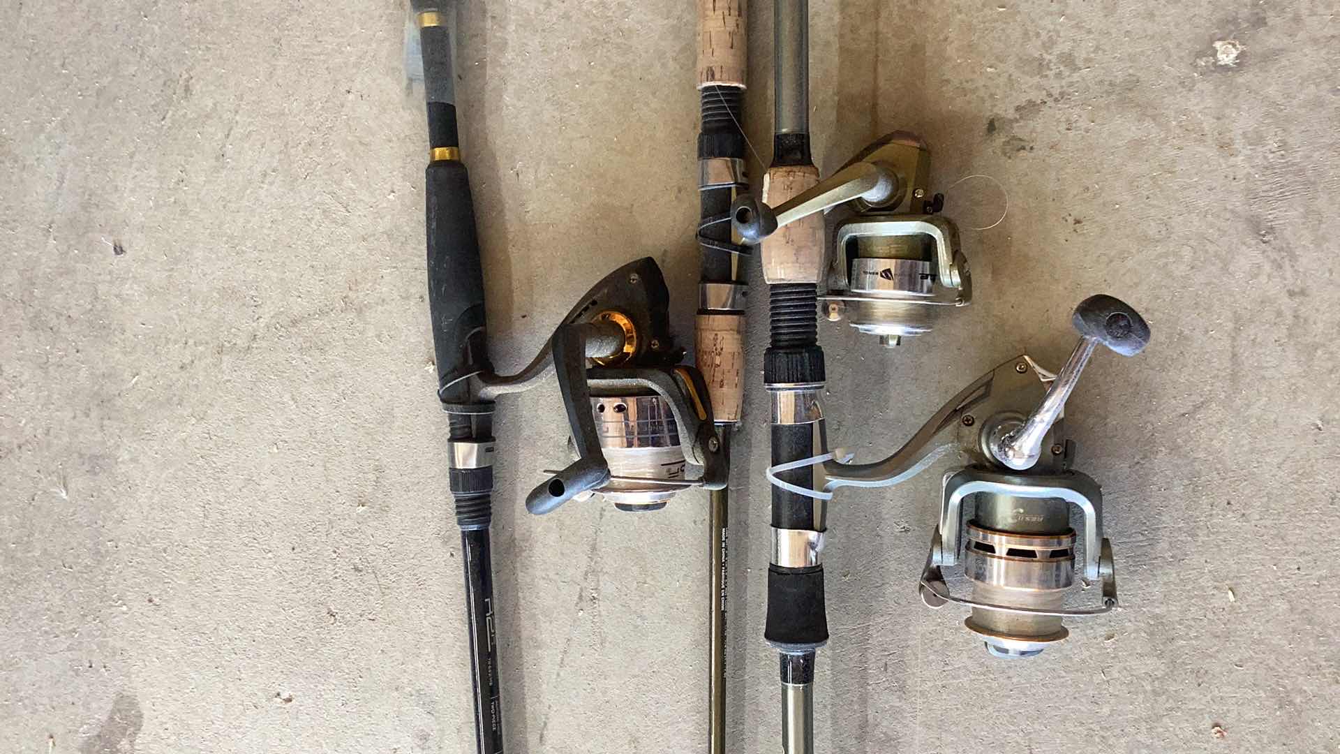 Photo 2 of THREE FISHING RODS AND REELS