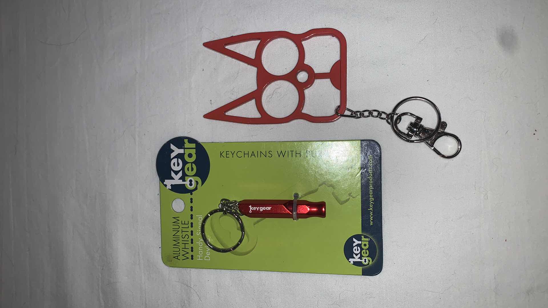 Photo 1 of KEYCHAIN PROTECTION SET WITH WHISTLE AND CAT EYES MELEE