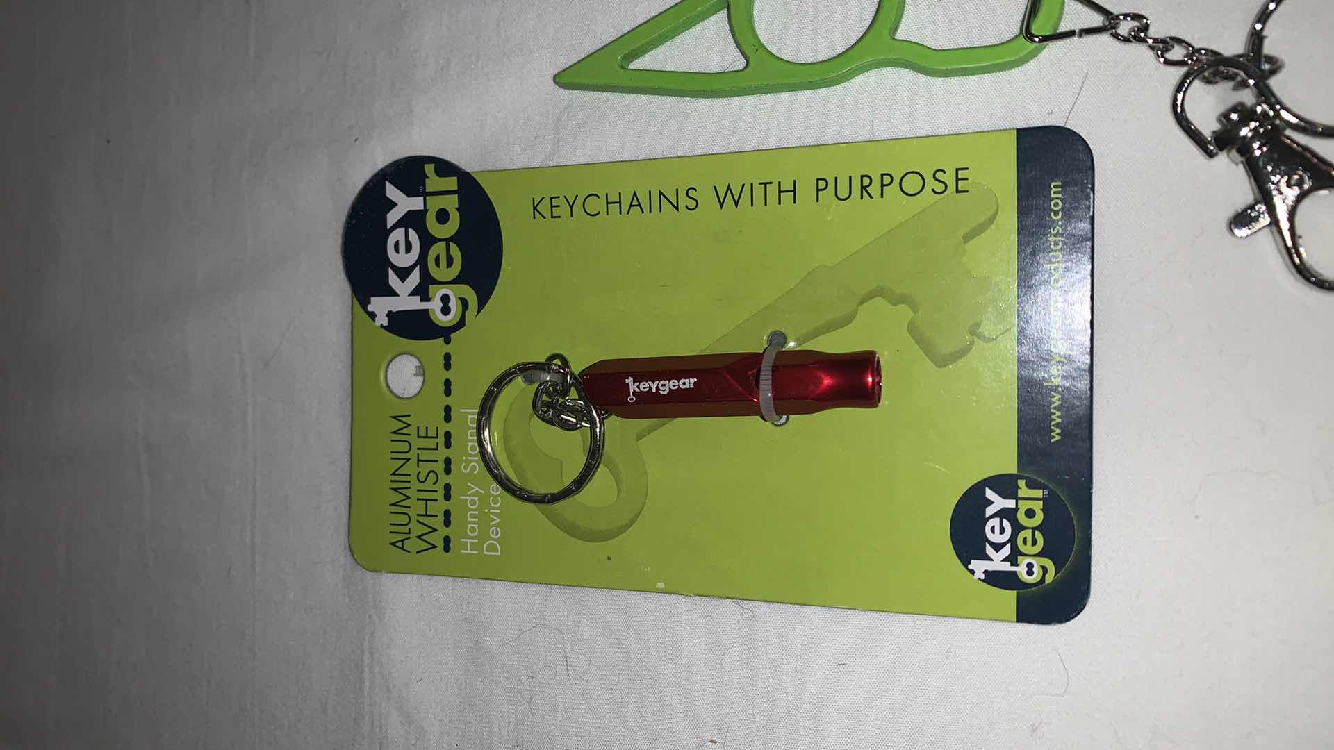 Photo 2 of KEYCHAIN PROTECTION SET WITH WHISTLE AND CAT EYES MELEE