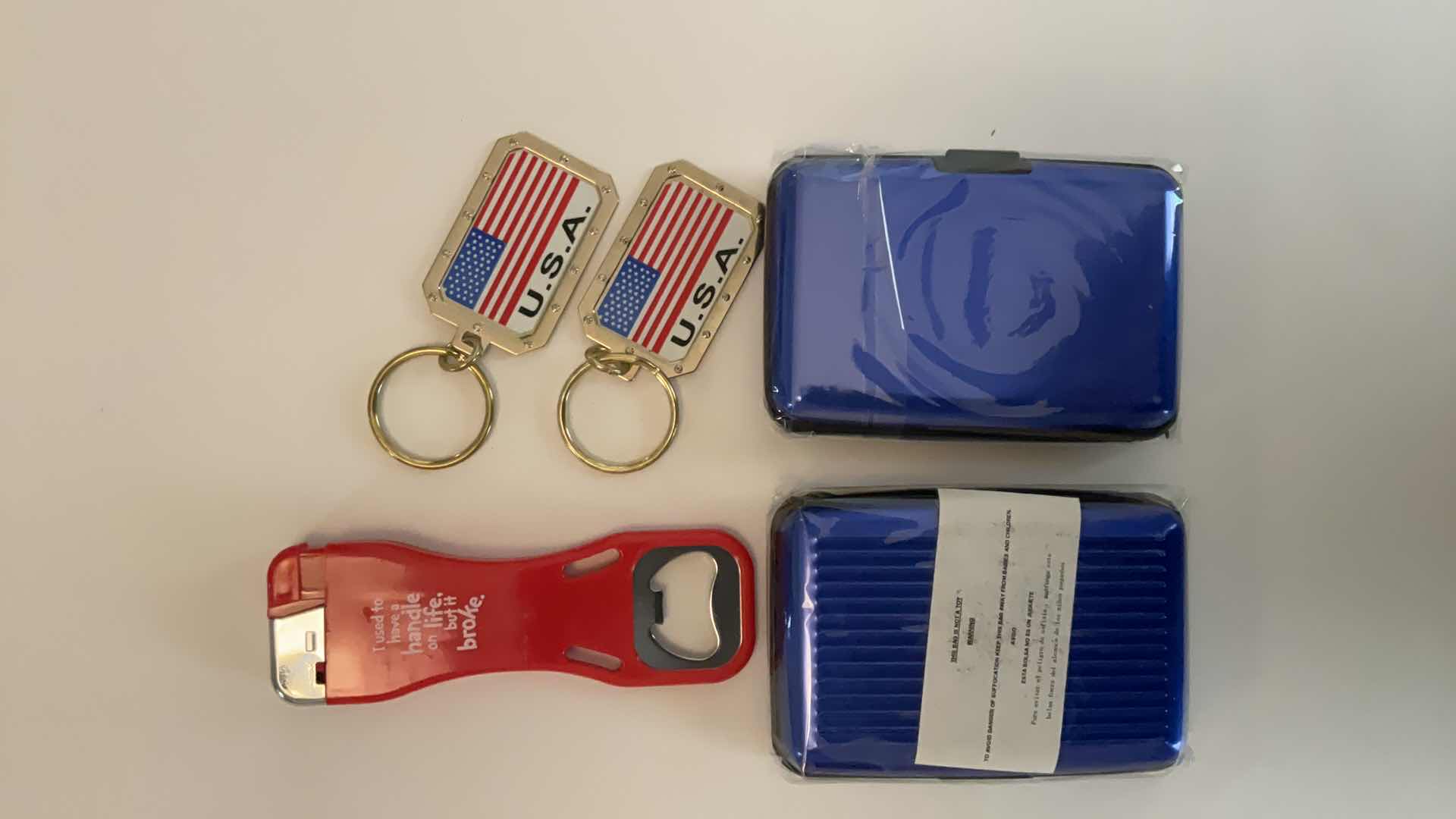 Photo 1 of KEYCHAINS, CARDHOLDERS AND BOTTLE OPENER/LIGHTER