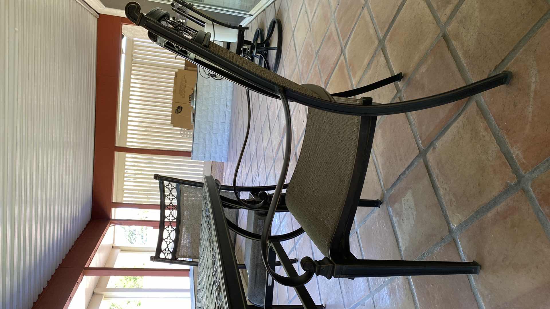 Photo 4 of ALUMINUM PATIO TABLE 67” X 38” H29” WITH 4 CHAIRS