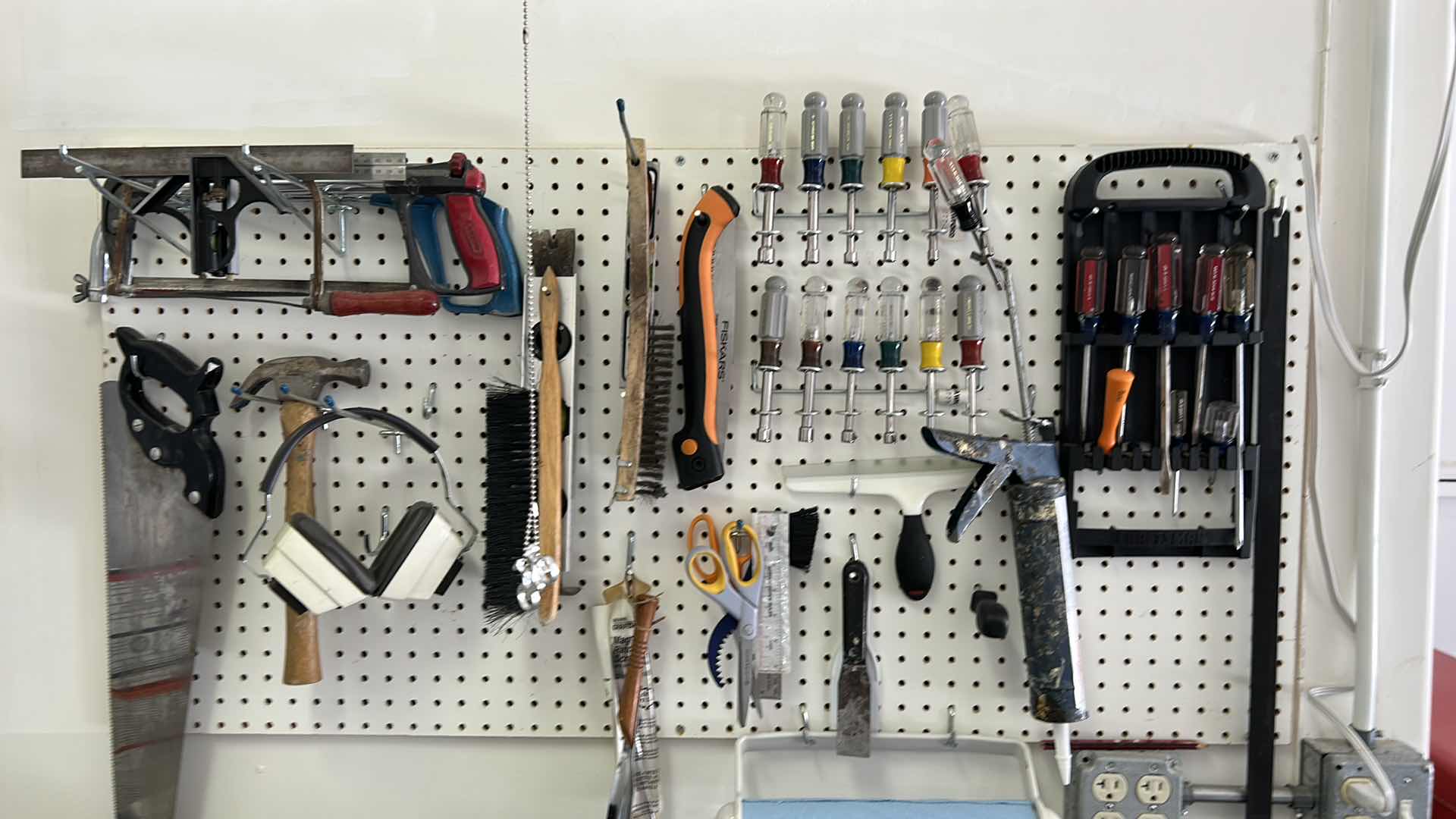 Photo 3 of CONTENTS SIDE WALL IN GARAGE, INCLUDES WORK BENCH, AND ALL TOOLS ON BENCH, PEG BOARD AND HANGING LIGHT FIXTURE 43” x 25.5” x H38”
