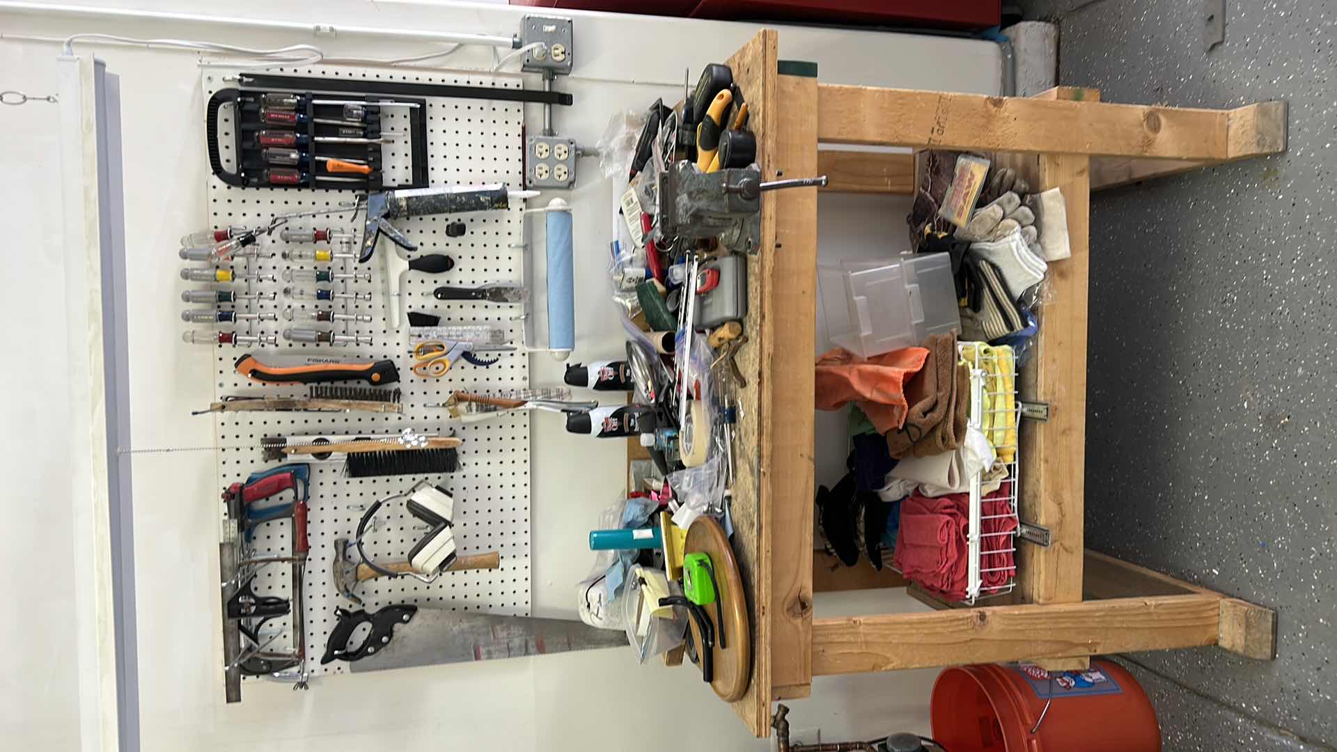 Photo 1 of CONTENTS SIDE WALL IN GARAGE, INCLUDES WORK BENCH, AND ALL TOOLS ON BENCH, PEG BOARD AND HANGING LIGHT FIXTURE 43” x 25.5” x H38”
