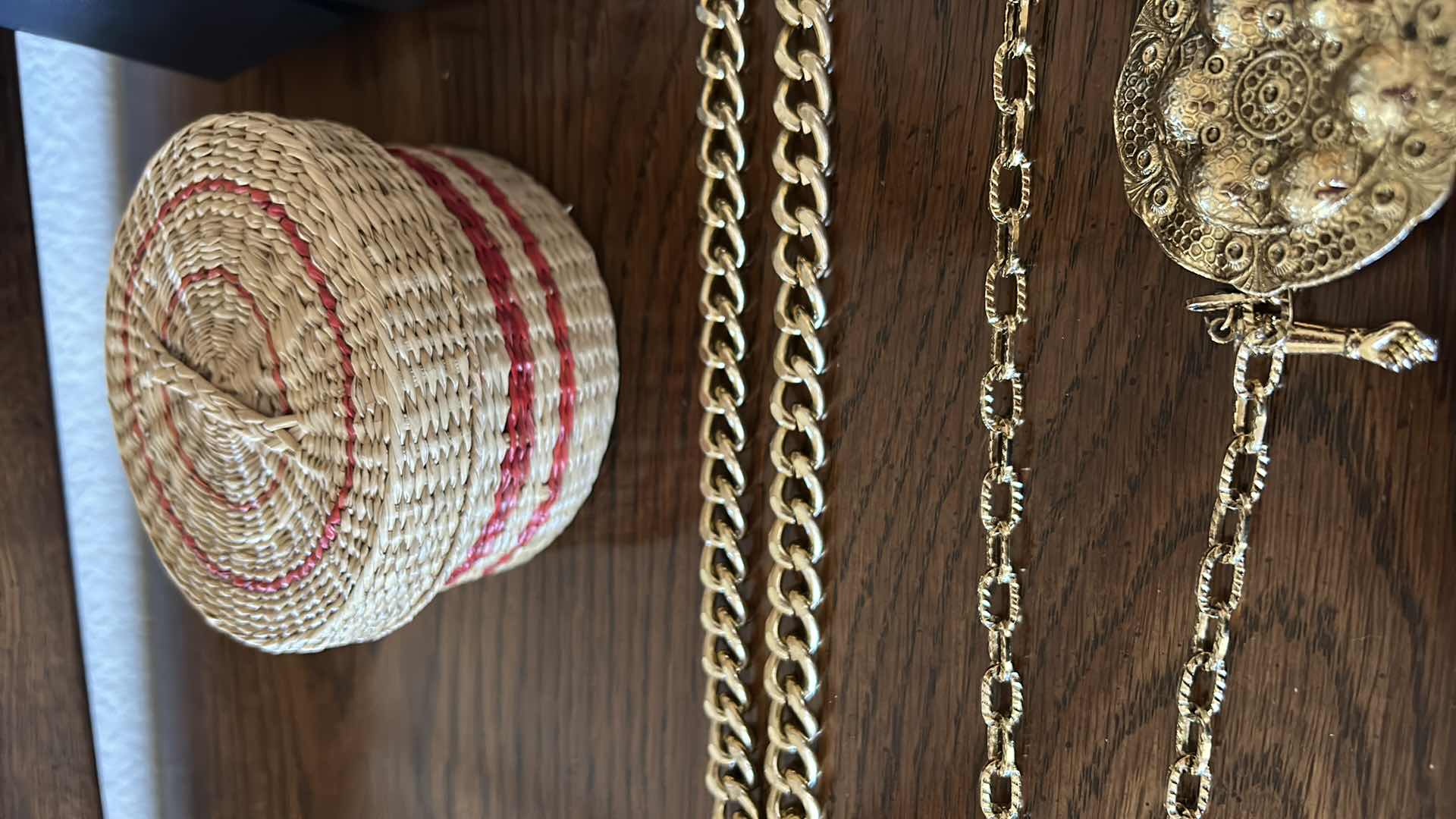 Photo 4 of Three gold chain belts, a collection of bracelets and wicker basket