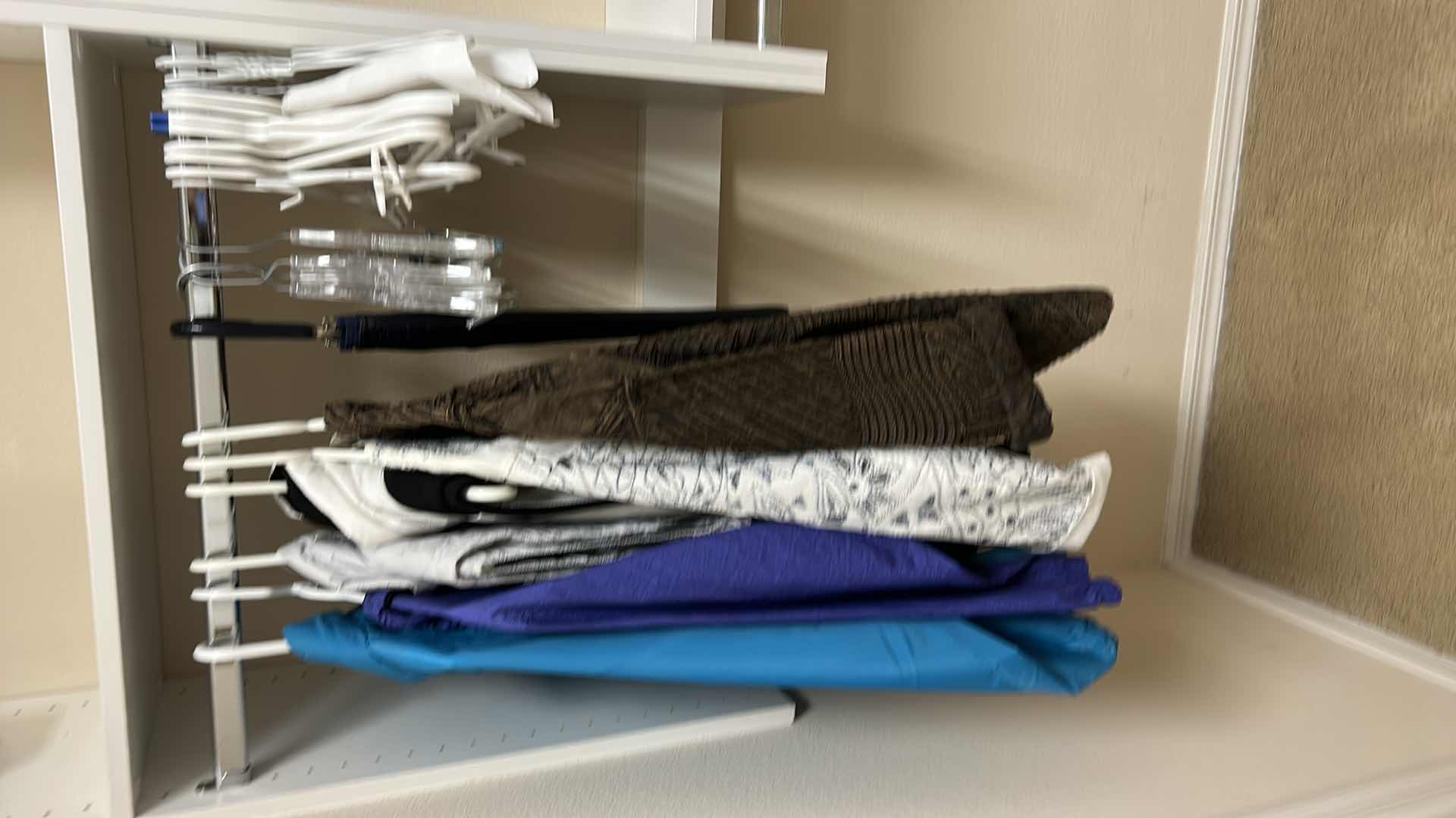 Photo 1 of Women’s clothing assortment, mostly size, large jacket, vest, and hangers