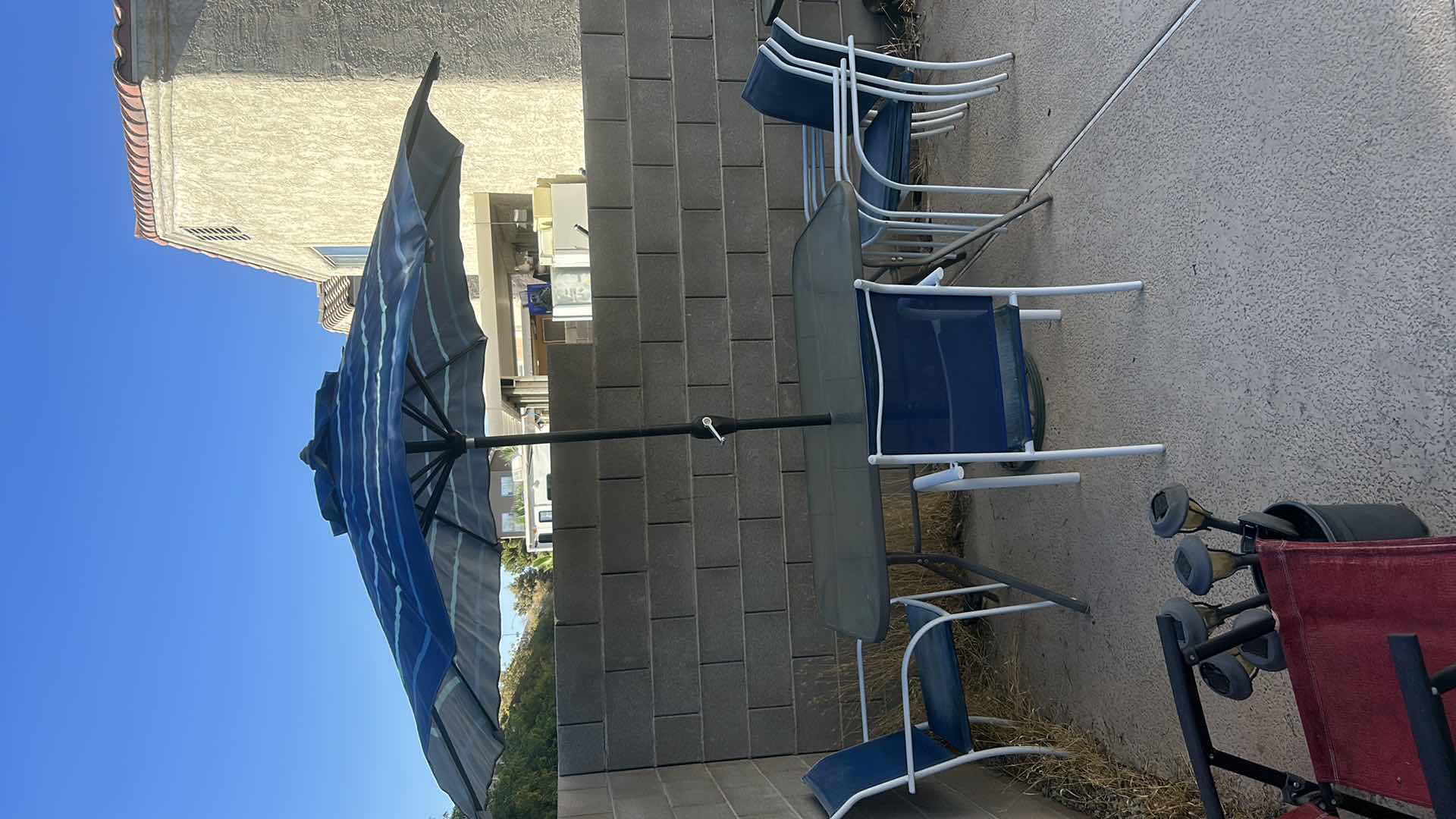 Photo 4 of PATIO TABLE AND 5 CHAIRS W UMBRELLA