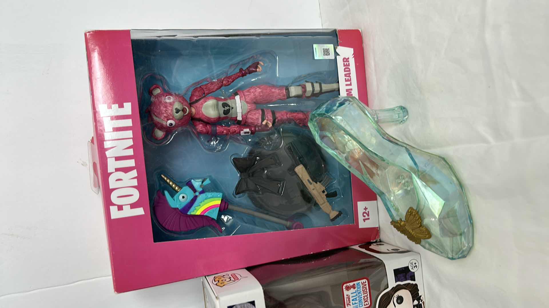 Photo 3 of 4 FIGURINES- 2 POP, FORTNITE AND SLIPPER