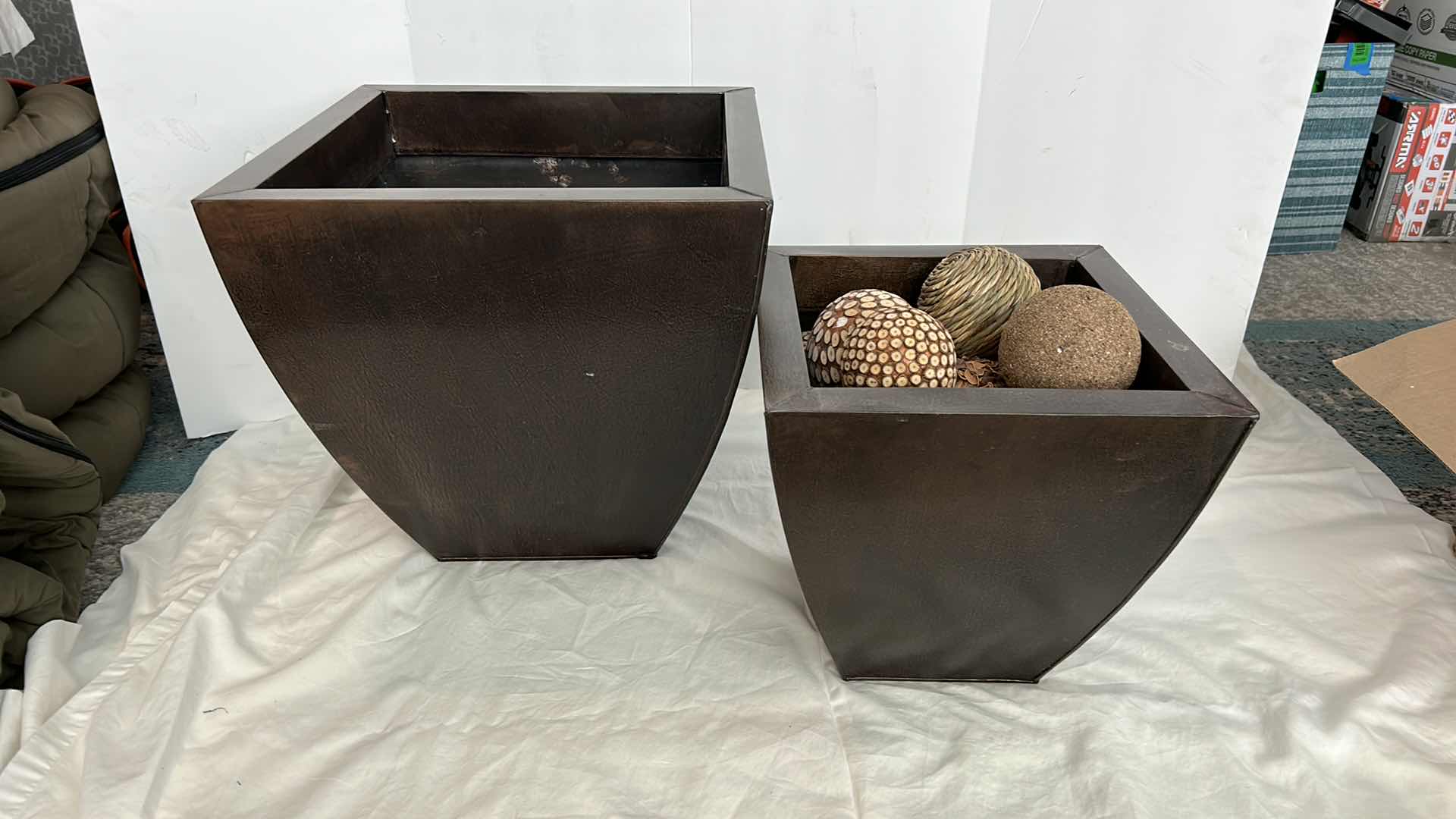 Photo 2 of HOME DECOR - TWO TIN BLOWN PLANTERS AND ASSORTMENT BALLS TALLEST IS 16” x 15”