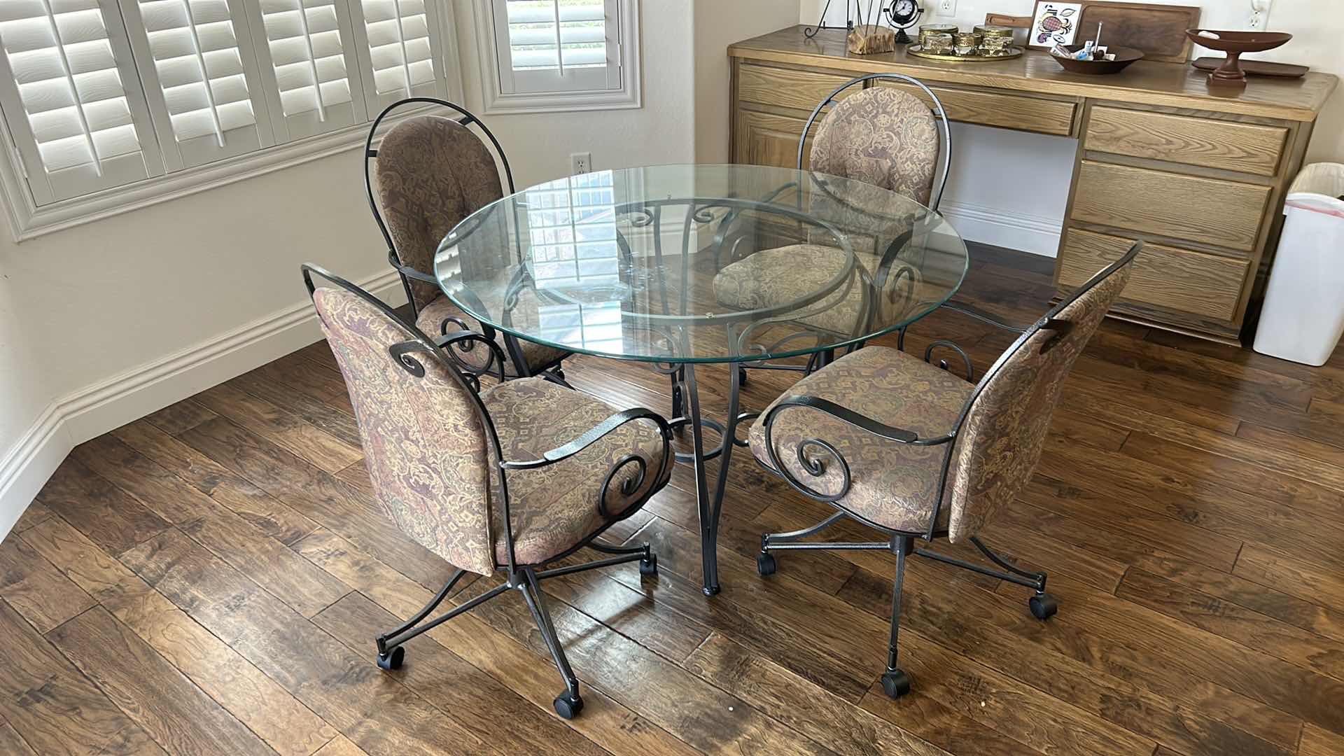 Photo 2 of WROUGHT IRON ROUND DINING ROOM TABLE W GLASS TOP AND 4 CHAIRS ON WHEELS  48” ROUND H28.5”