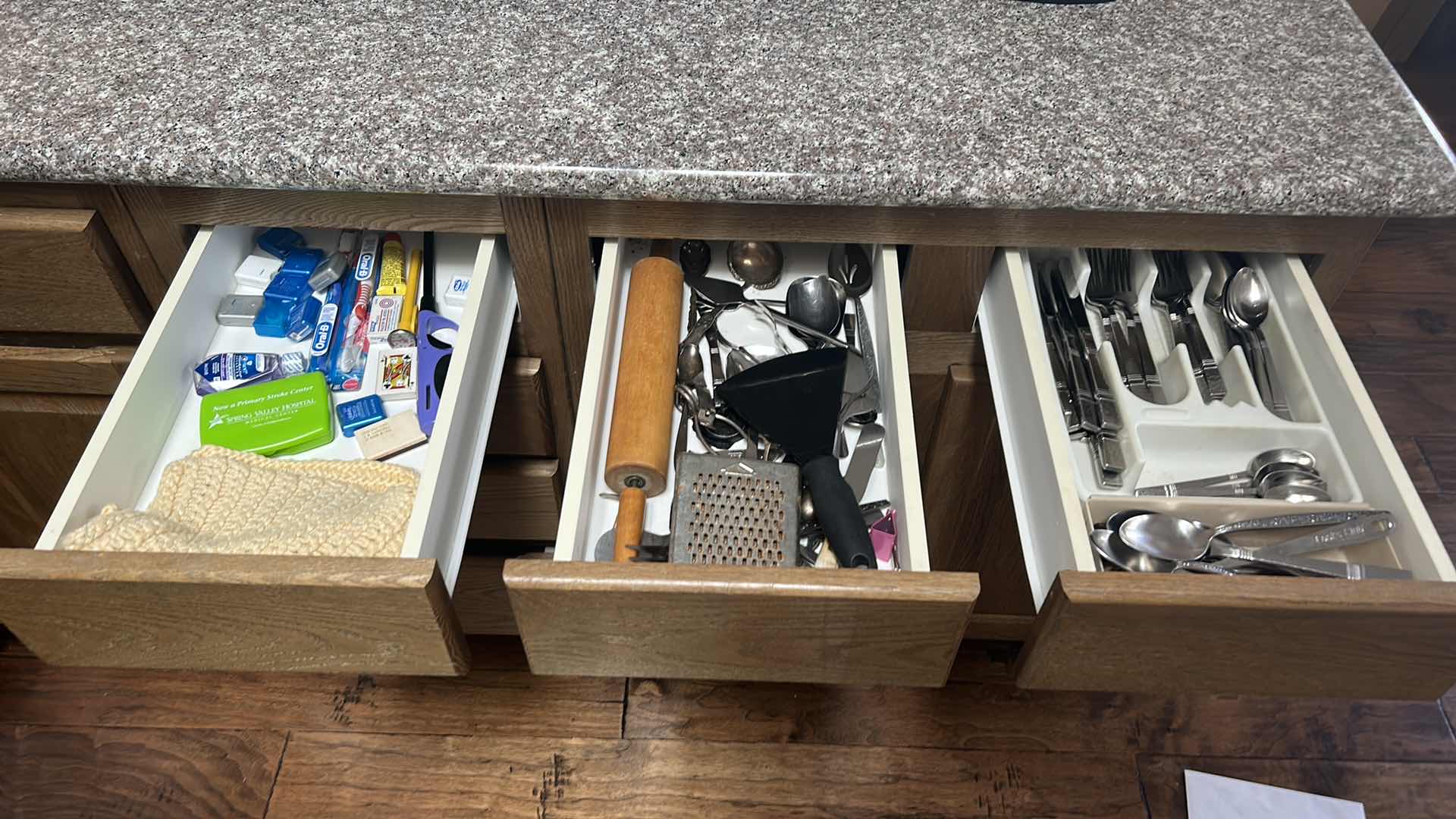 Photo 1 of CONTENTS OF 3 DRAWERS IN KITCHEN