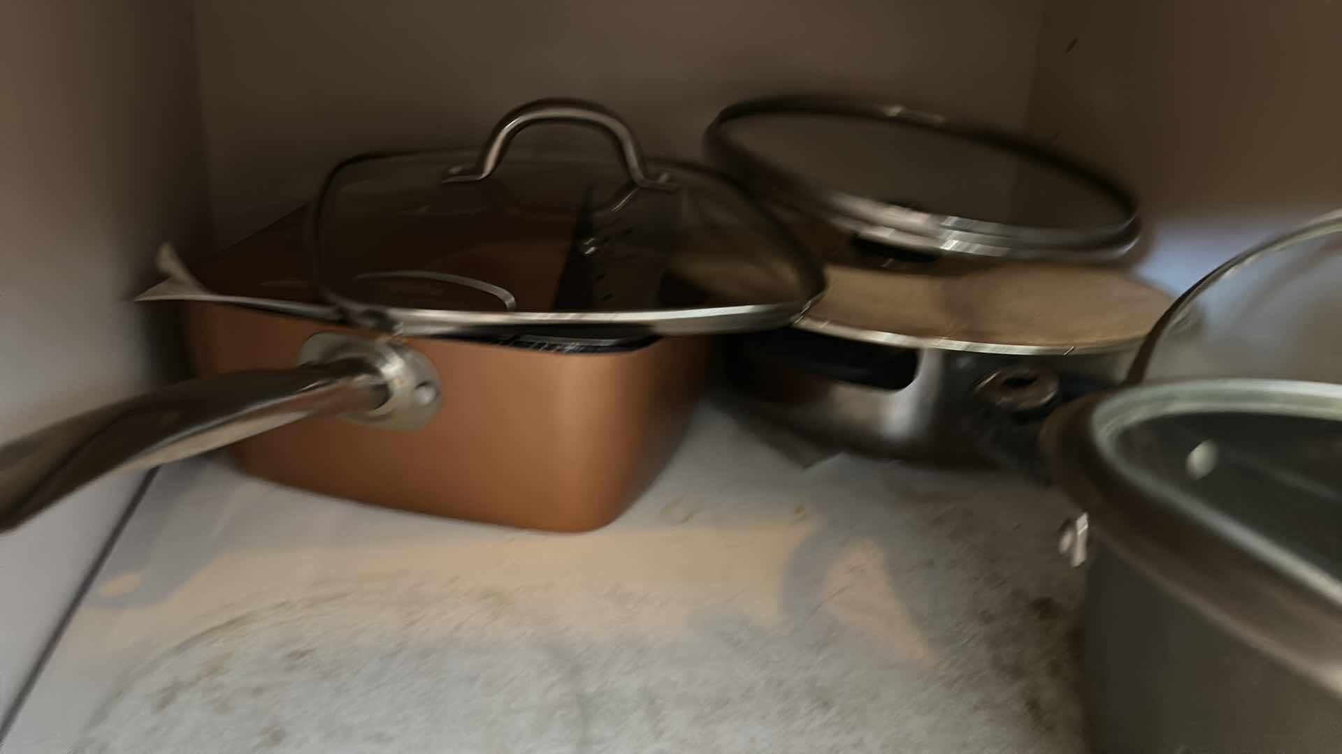 Photo 5 of CONTENTS OF KITCHEN CABINET-.POTS PANS AND MORE