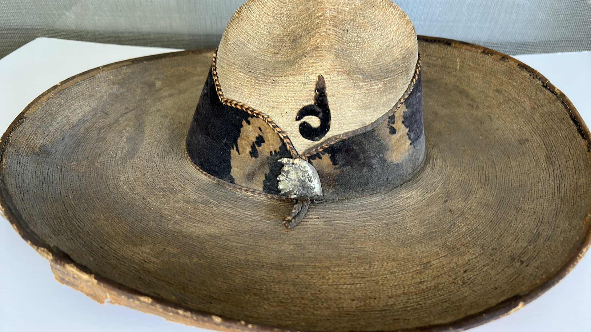 Photo 2 of VINTAGE SOMBRERO WITH LEATHER BAND AND SILVER INDIANS.