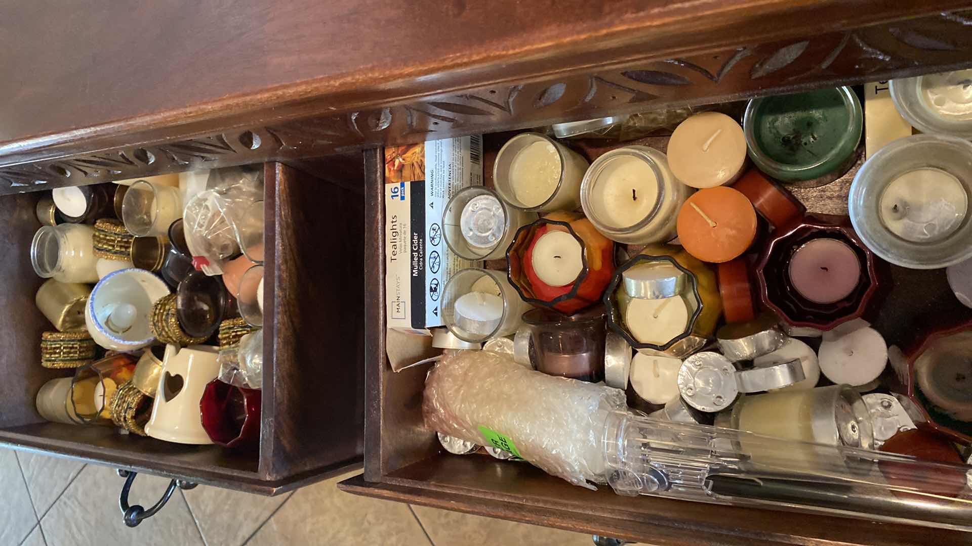 Photo 1 of 2 DRAWERS OF VOTIVE CANDLES AND HOLDERS IN SIDEBOARD