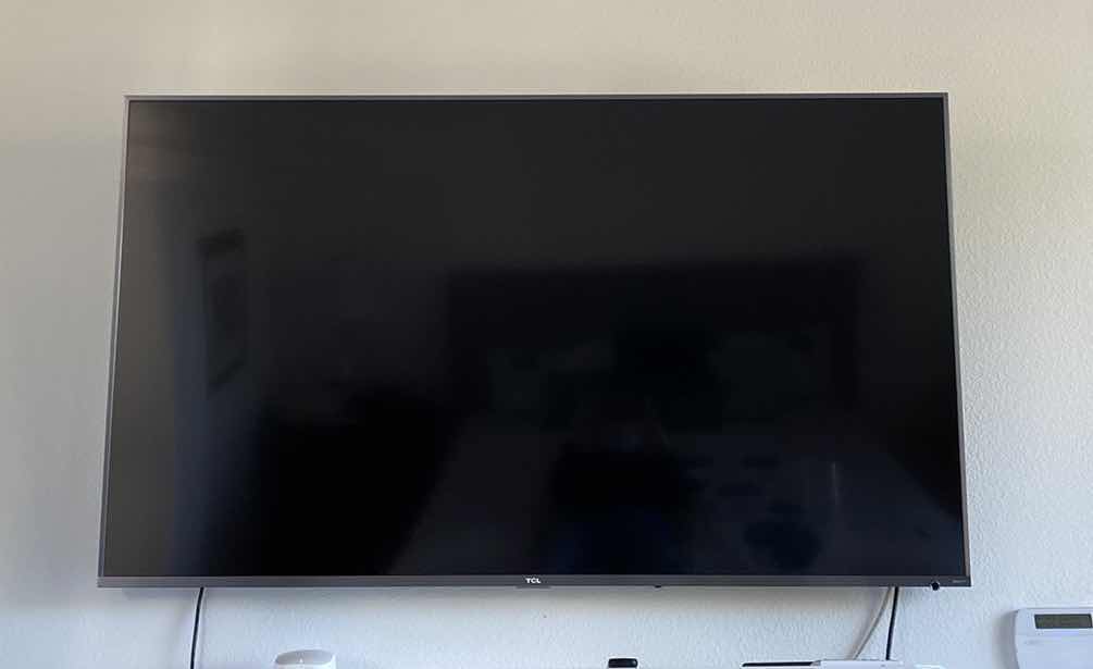 Photo 1 of TCL 65” ROKU TV WITH REMOTE