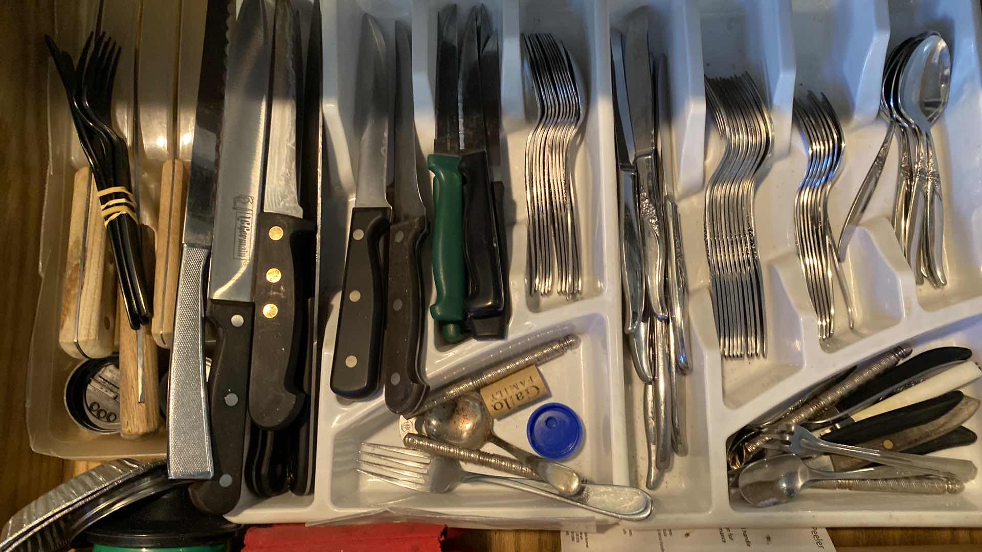 Photo 1 of KITCHE DRAWER OF SILVERWARE AND WASHINGTON FORGE KNIVES