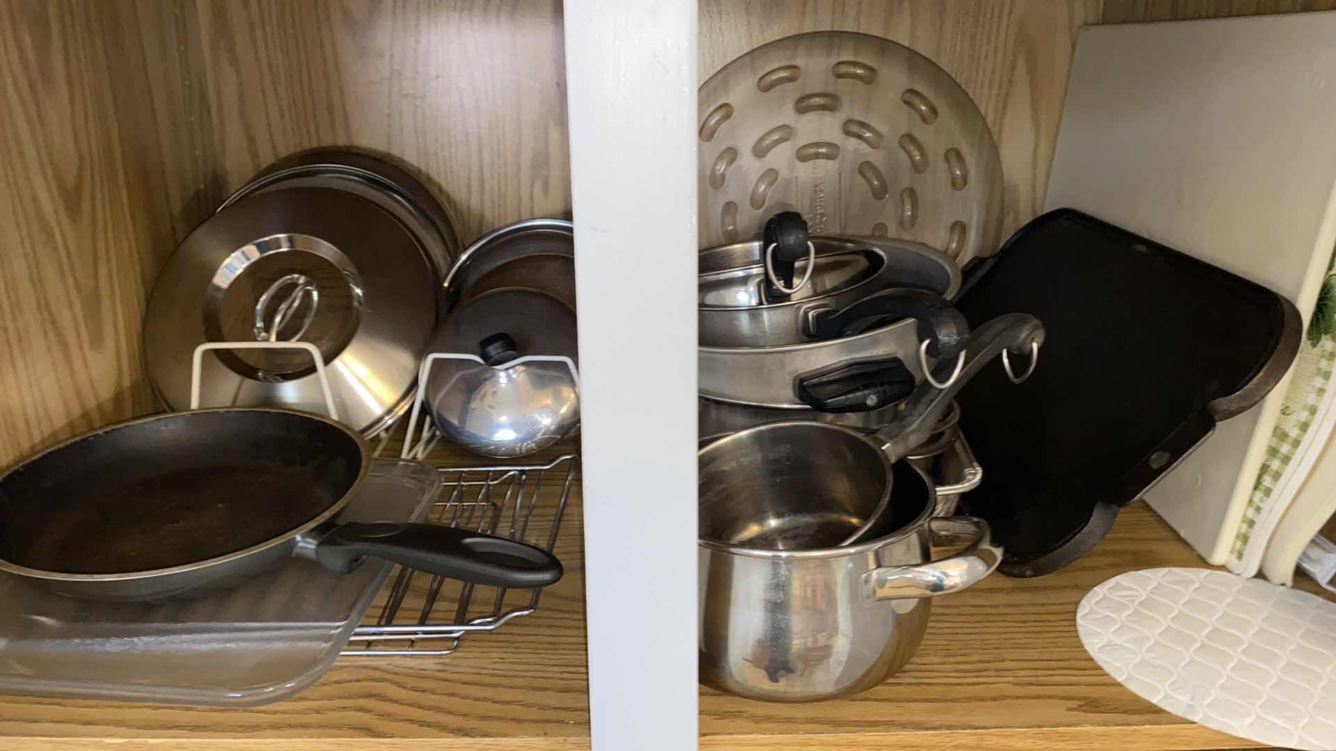 Photo 2 of CONTENTS OF KITCHEN CABINET POTS AND PANS AND MORE