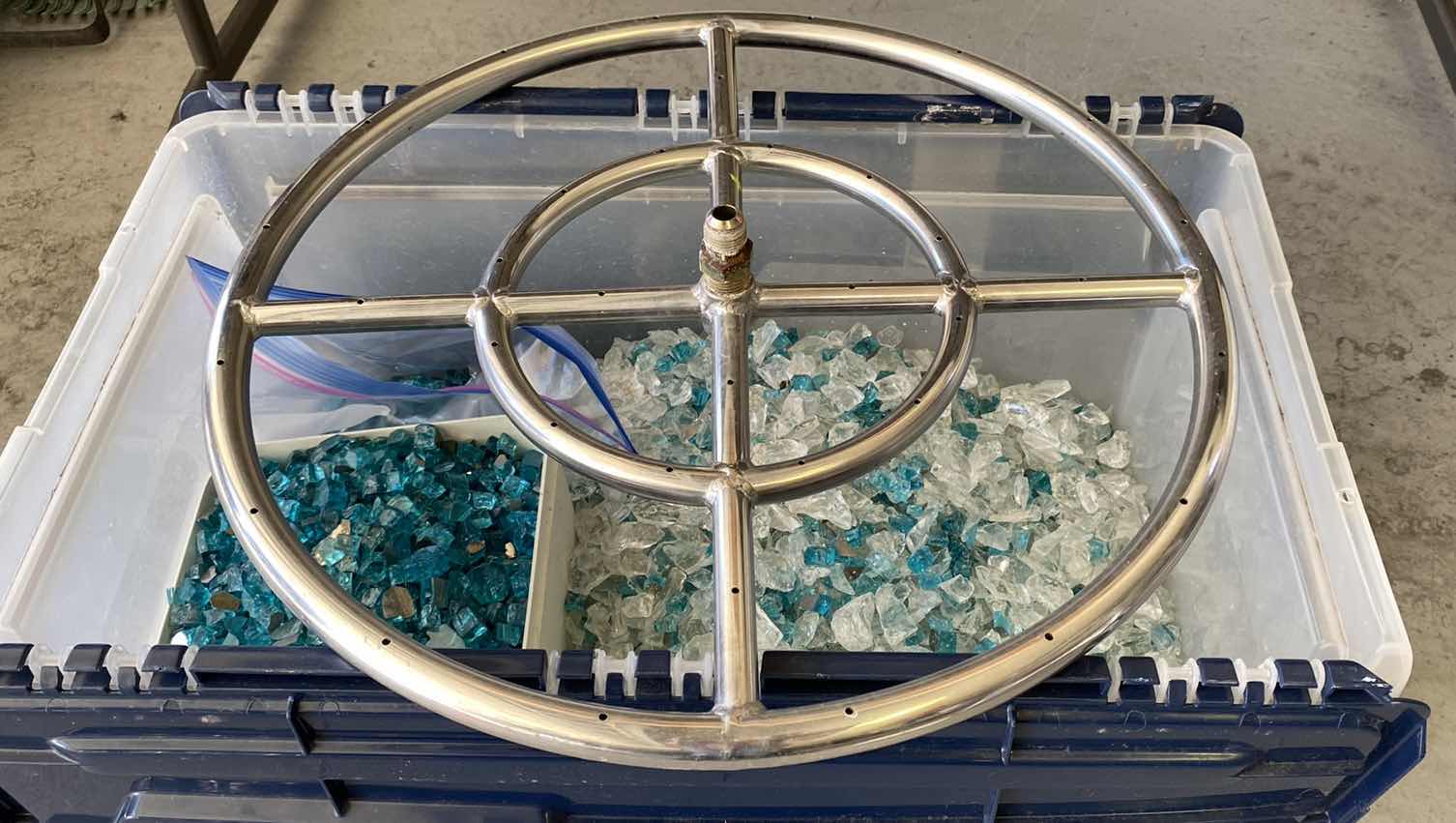 Photo 1 of $350 LARGE CRATE OF FIRE PIT GLASS AND 18” RING FOR FIRE PIT