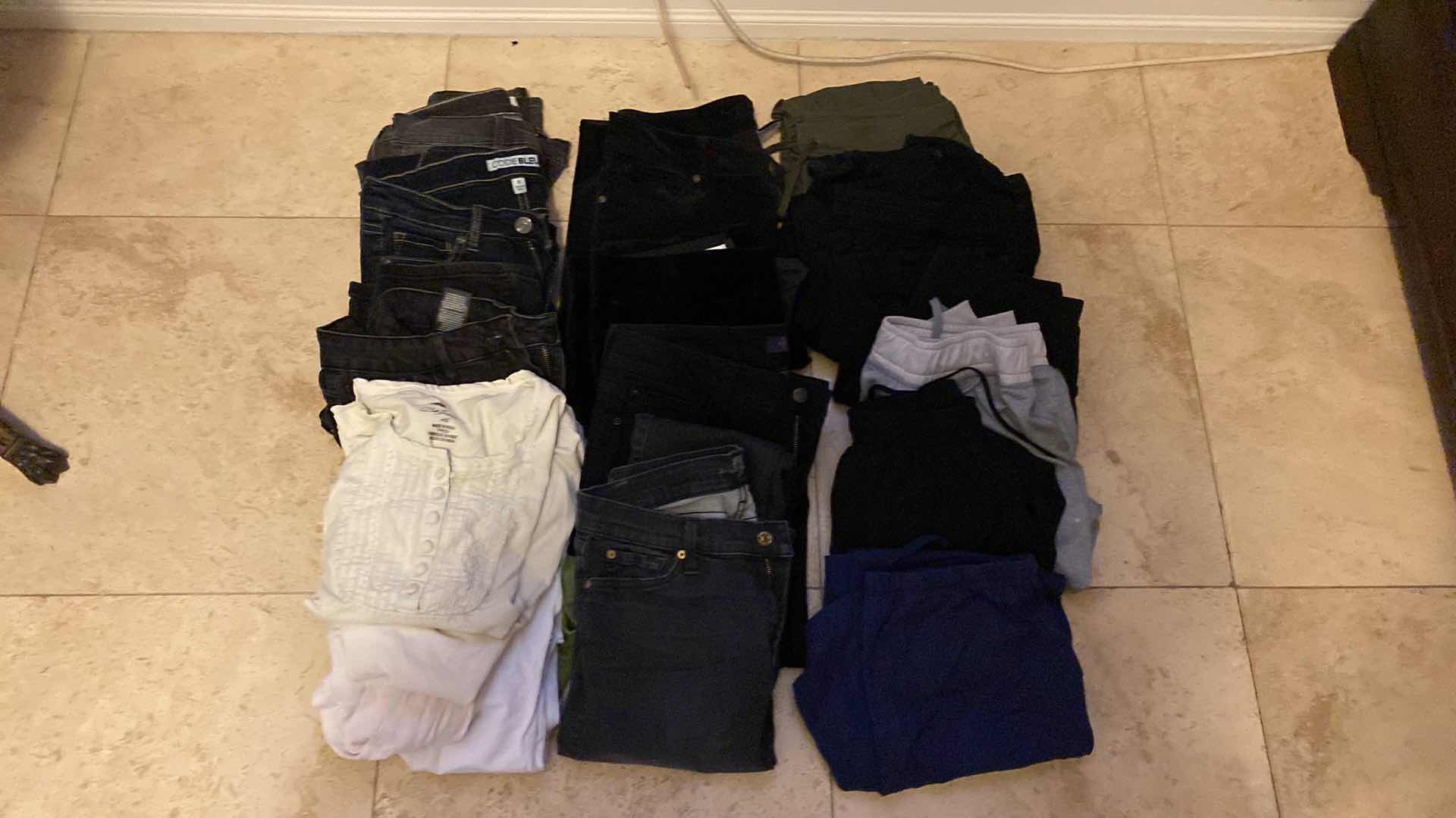 Photo 2 of WOMENS SIZE 6 AND 8 JEANS, TOPS AND ATHLETIC PANTS