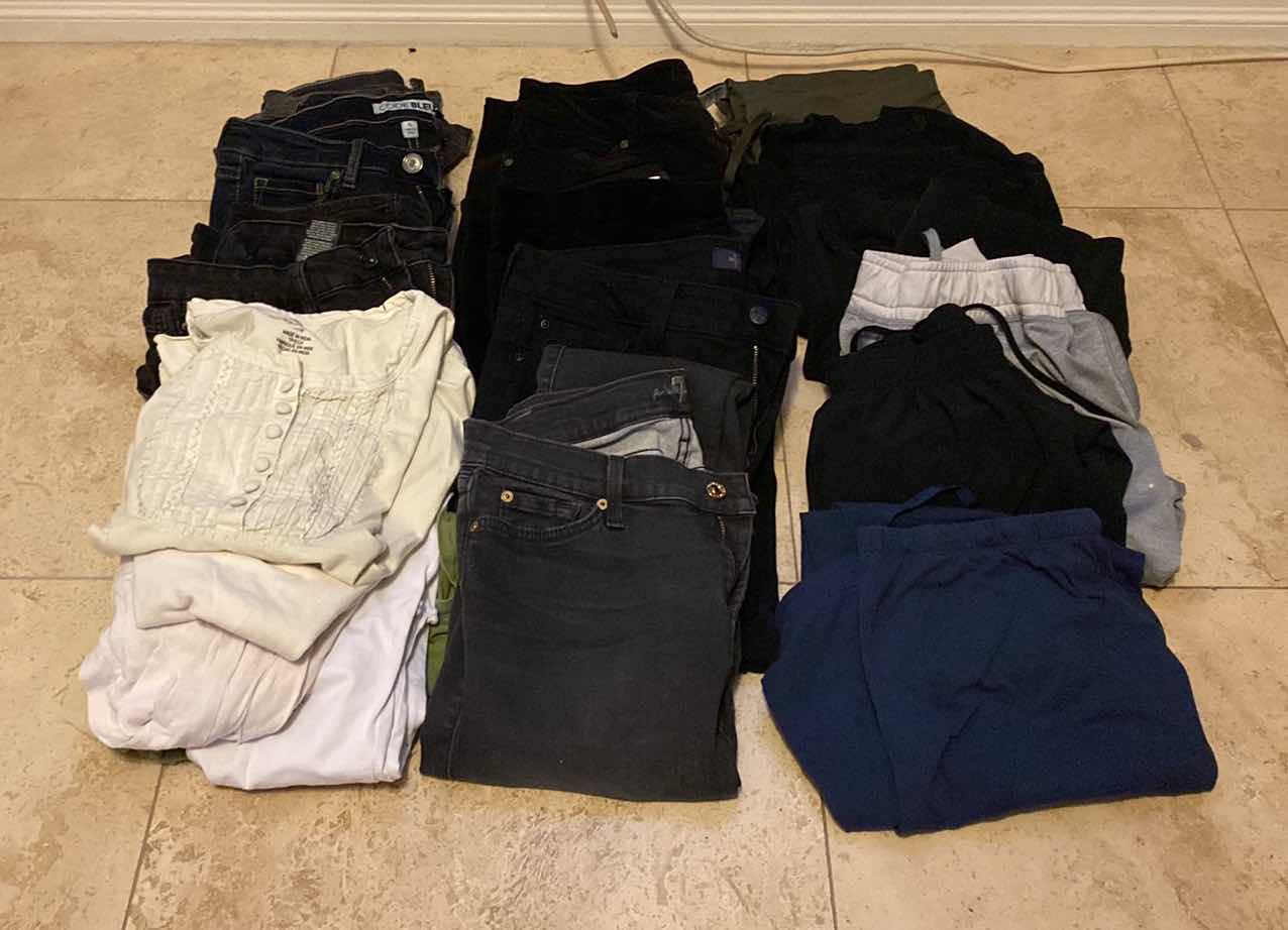 Photo 1 of WOMENS SIZE 6 AND 8 JEANS, TOPS AND ATHLETIC PANTS