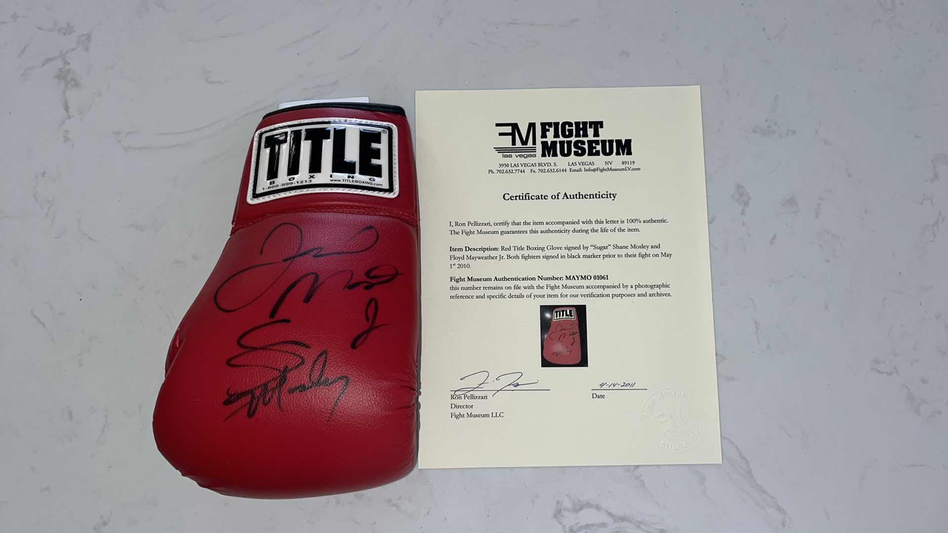 Photo 1 of RED TITLE BOXING GLOVE SIGNED BY “SUGAR” SHANE MOSLEY AND FLOYD MAYWEATHER Jr.