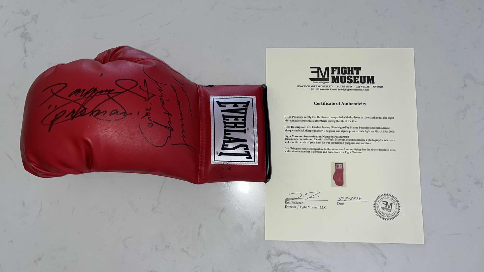 Photo 1 of RED EVERLAST BOXING GLOVE SIGNED BY MANNY PACQUIAO AND JUAN MANUEL MARQUEZ