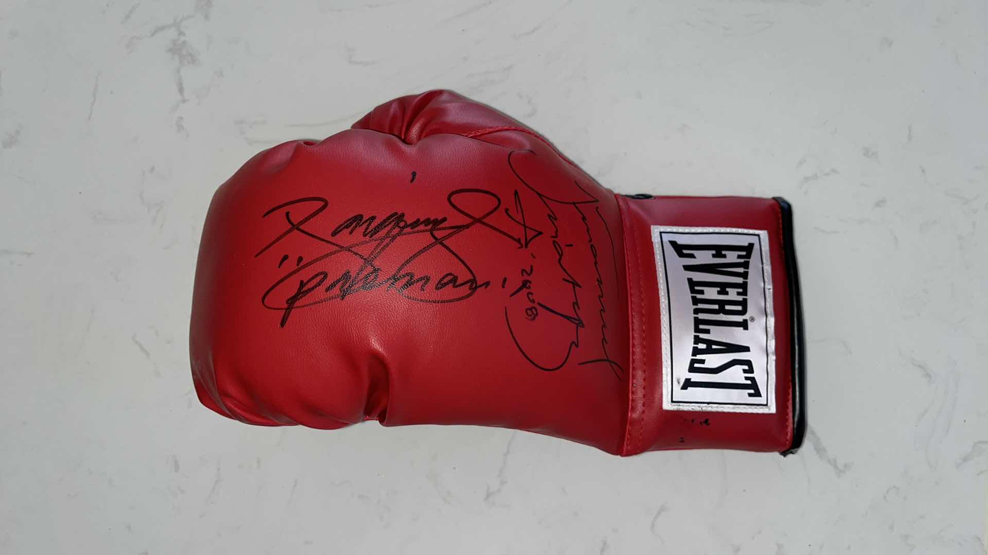 Photo 2 of RED EVERLAST BOXING GLOVE SIGNED BY MANNY PACQUIAO AND JUAN MANUEL MARQUEZ