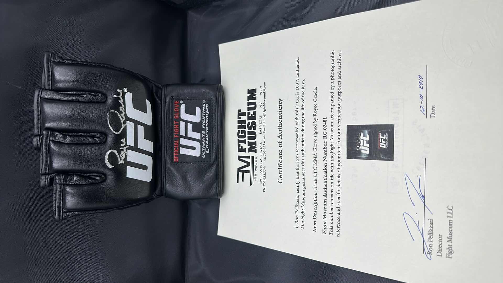 Photo 1 of ROYCE GRACIE SIGNED UFC GLOVE W COA