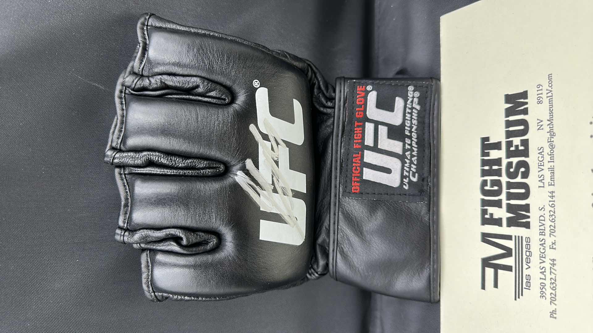 Photo 2 of GEORGE ST. PIERRE SIGNED UFC GLOVE W COA