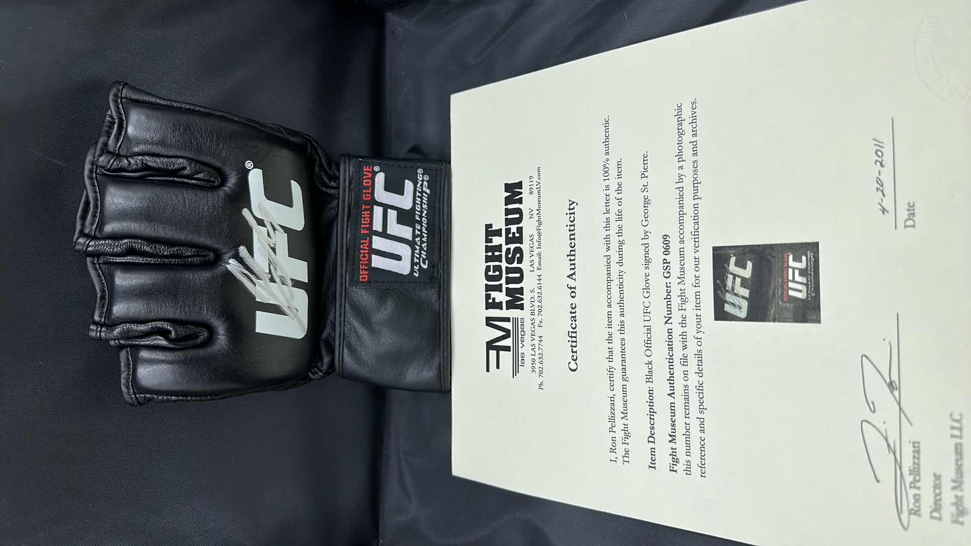 Photo 1 of GEORGE ST. PIERRE SIGNED UFC GLOVE W COA