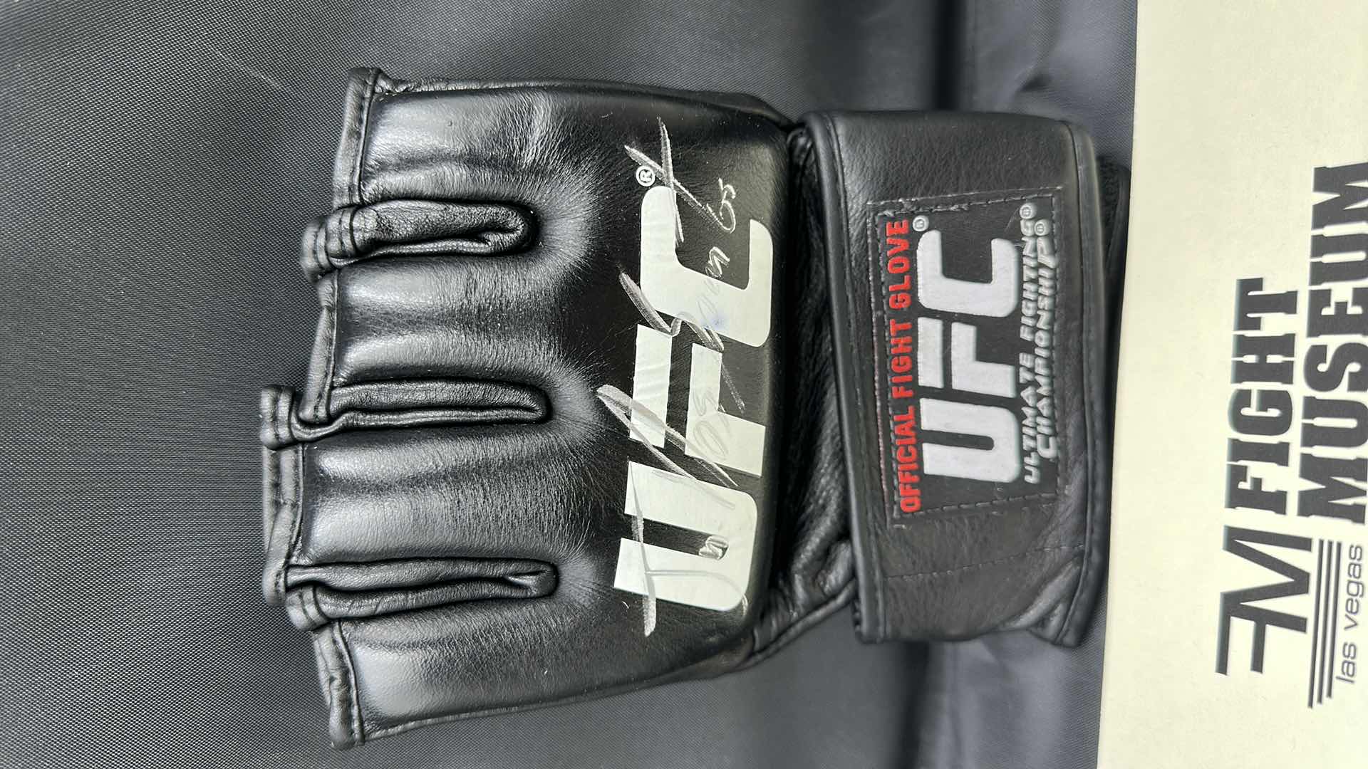 Photo 2 of JR. DOS SANTOS SIGNED UFC GLOVE W COA