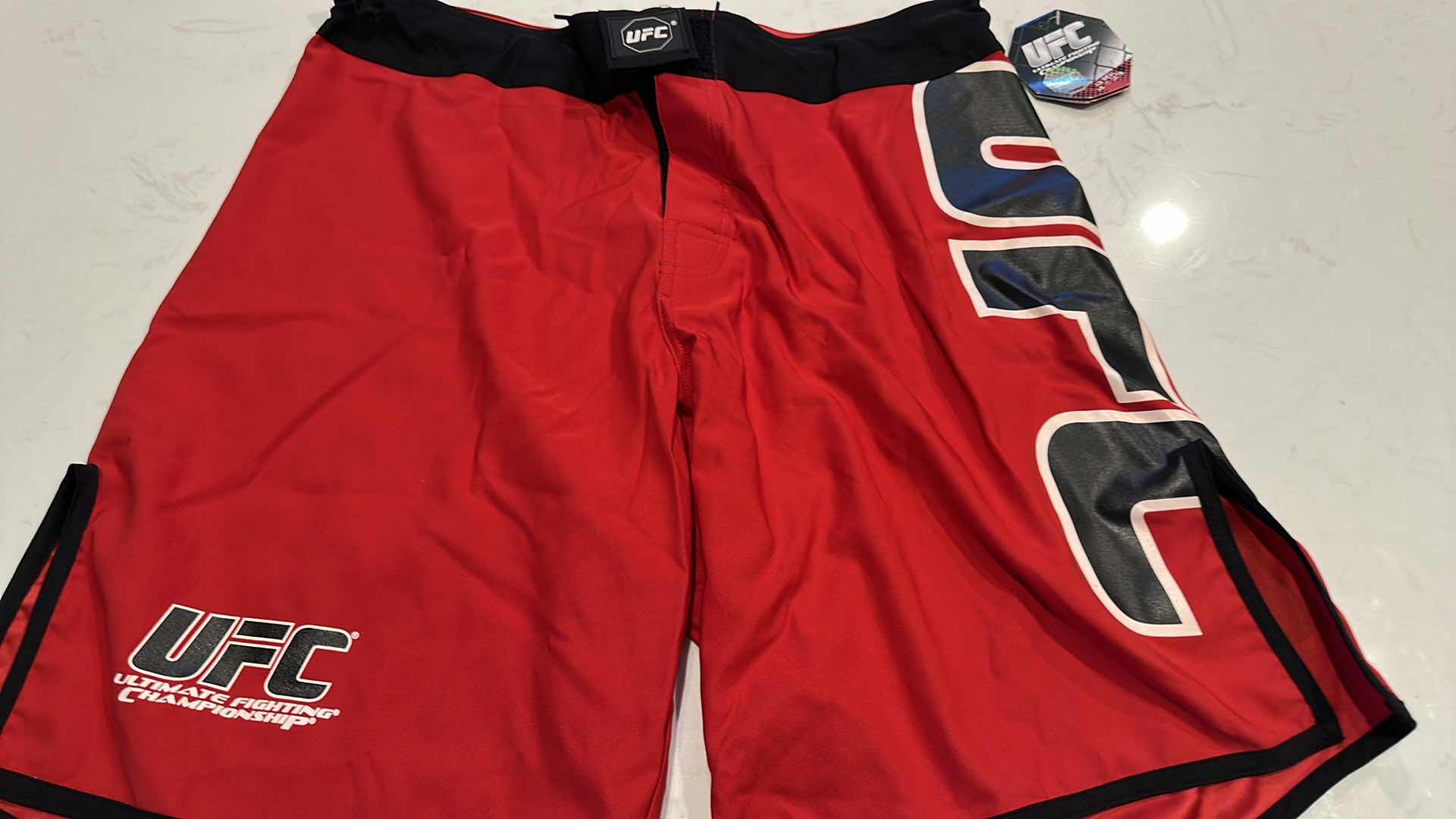 Photo 2 of OFFICIAL UFC TRAINING SHORTS SIZE 32