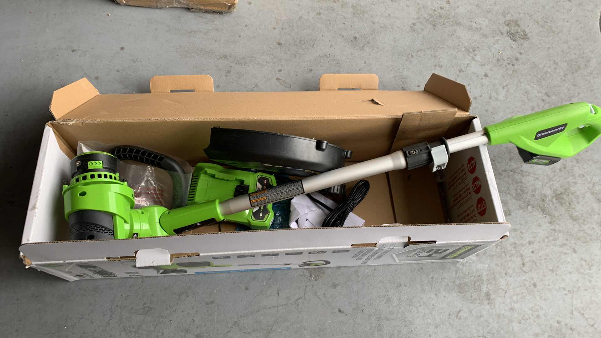 Photo 1 of GREENWORKS 12” STRING TRIMMER WITH LITHIUM BATTERY