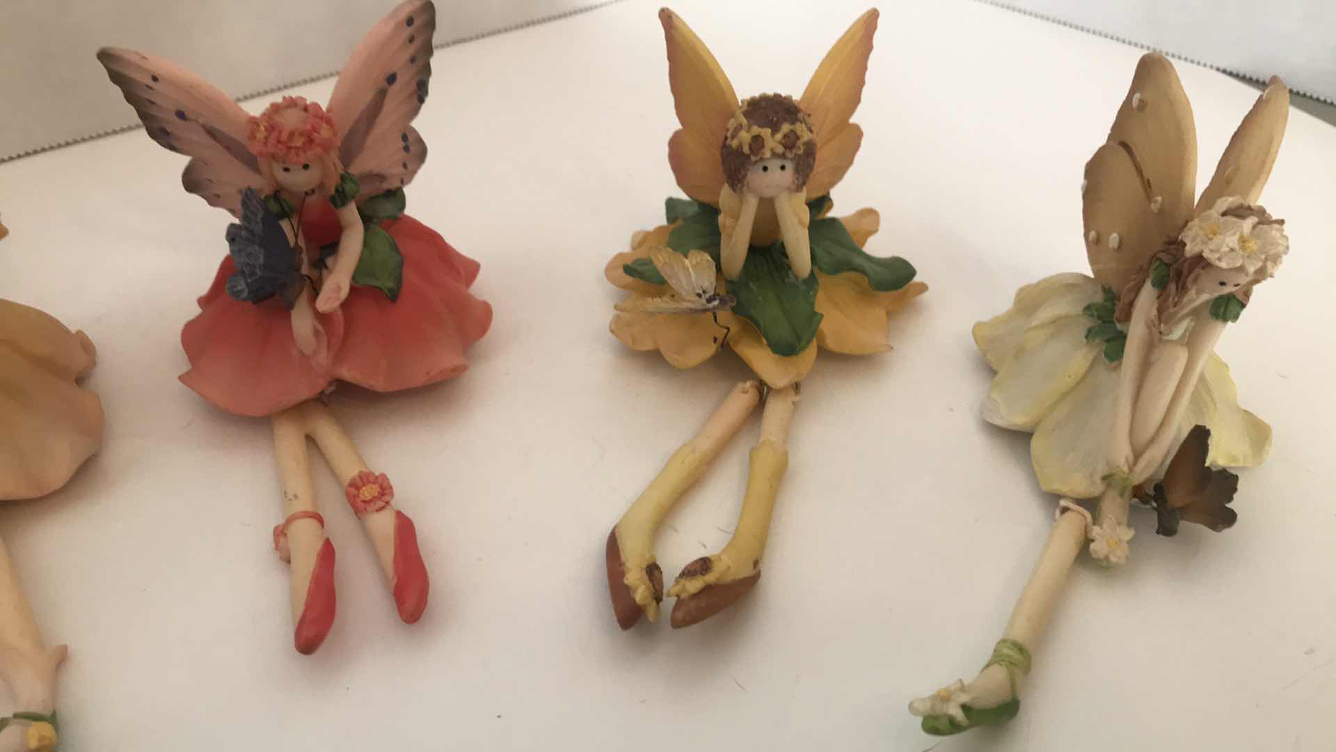 Photo 3 of COLLECTION OF SIX CERAMIC FAIRIES WITH DANGLING LEGS, APPROX 4” SITTING